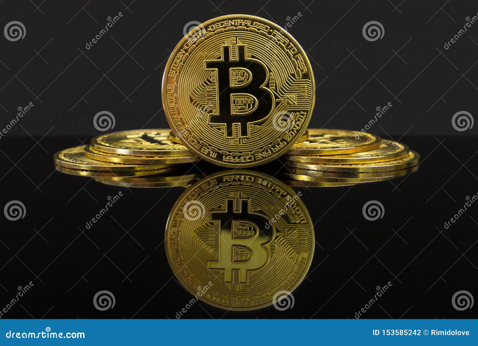 A Mirror Reflection Of A Big Golden BTC Coin. The Coin Of Bitcoin Is On