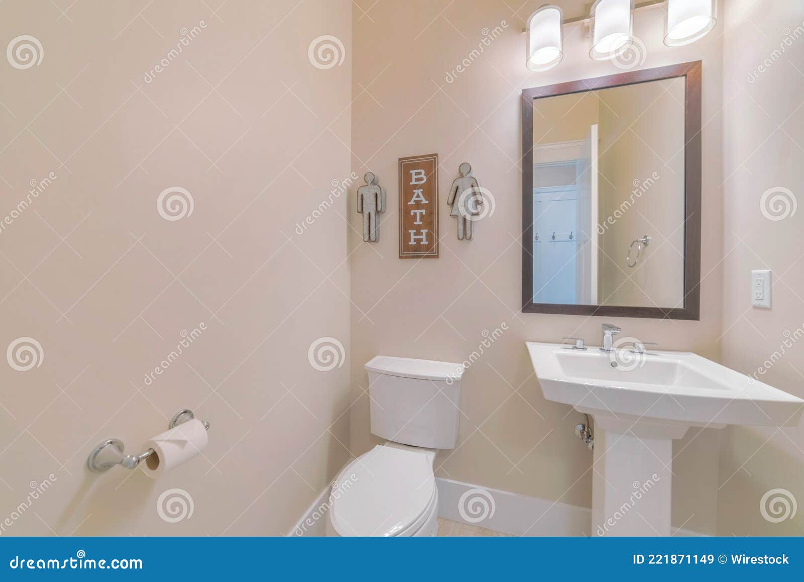 Mirror, a Sink, and a Toilet Seat in a Bathroom Stock Image Image of