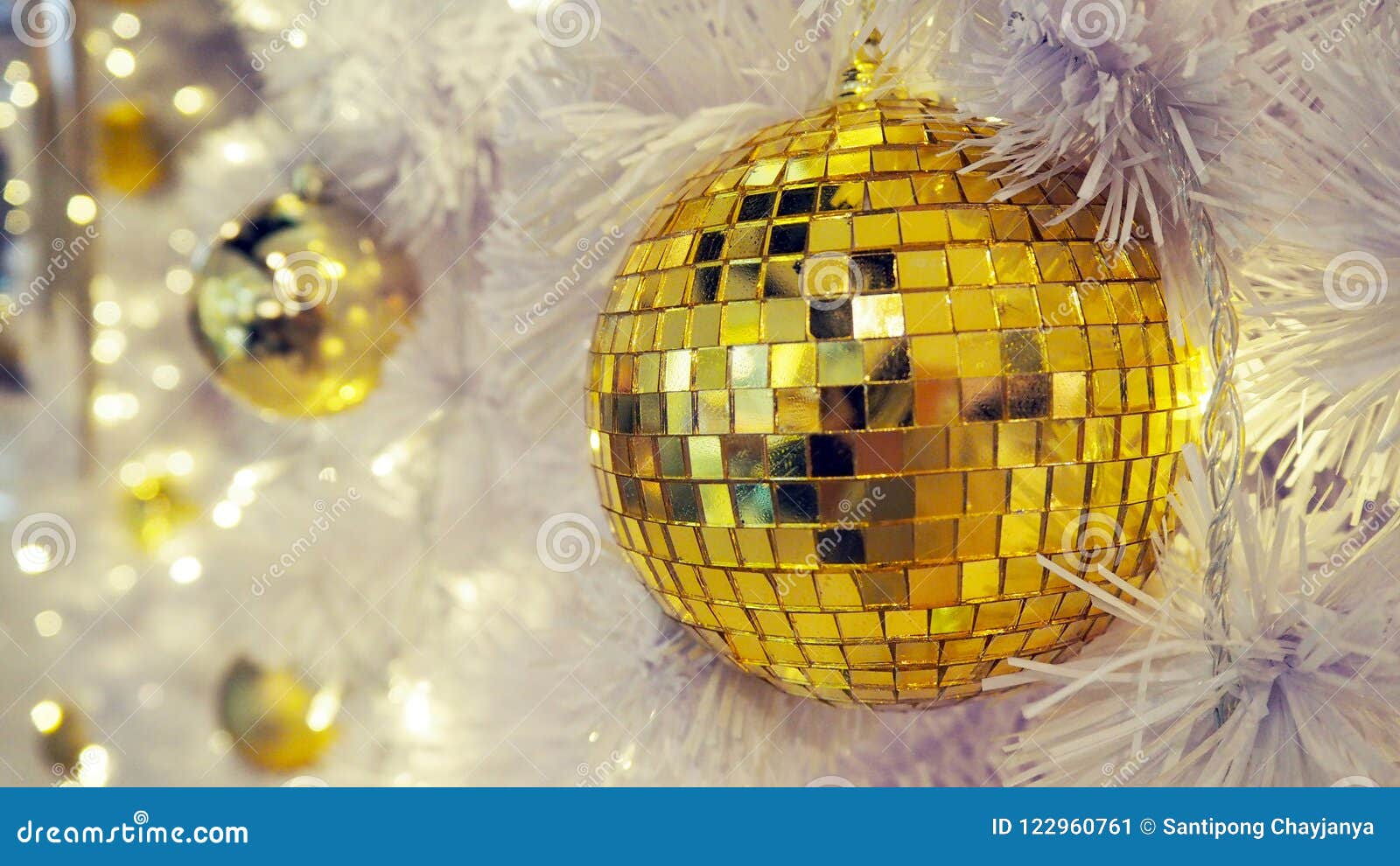 Mirrored Disco Ball And Christmas Decorations On A White