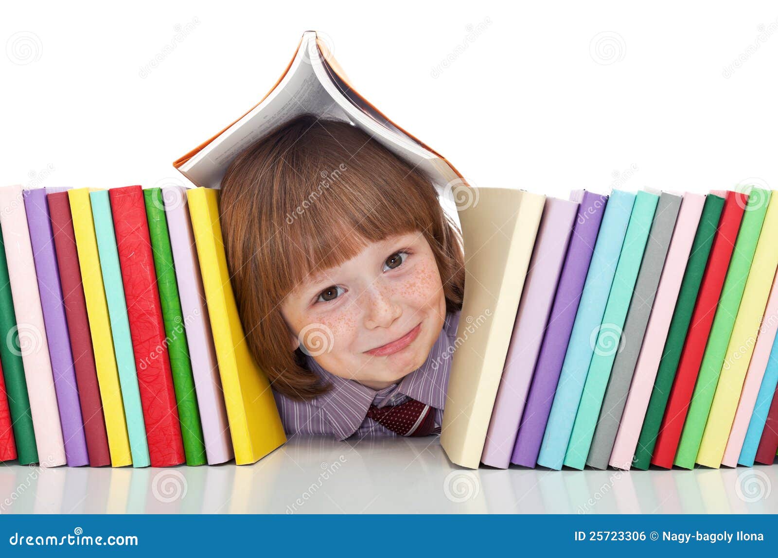 mischievous kid with freckles and books