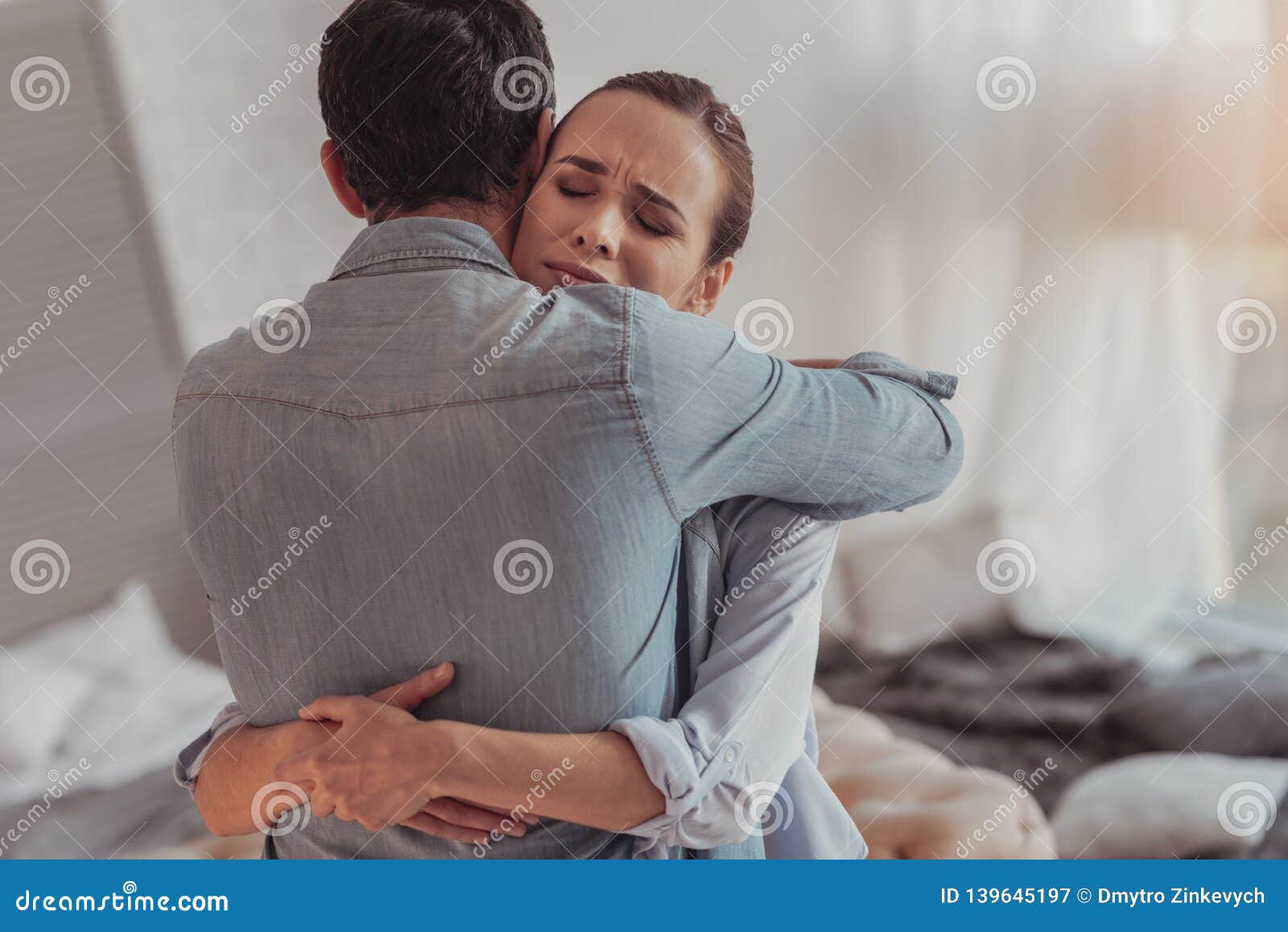 Portrait of Anxious Woman Embracing Her Husband Stock Image - Image of ...