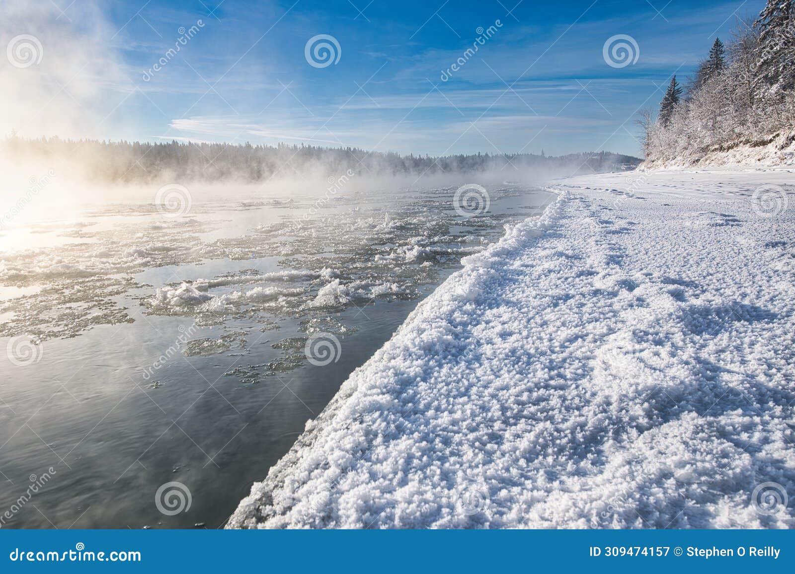 mist is burning off the ice on a cokd winters day