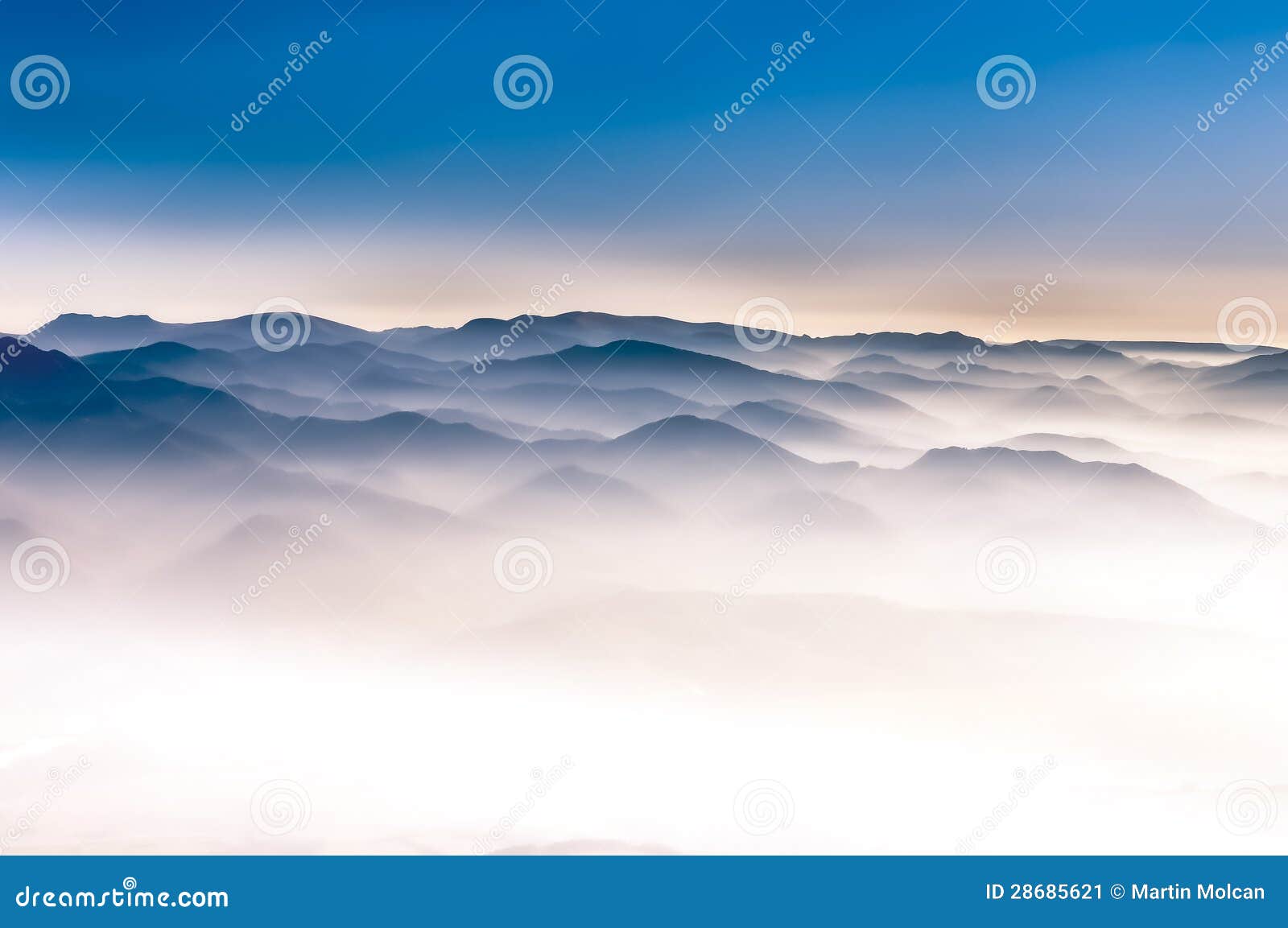 misty mountains landscape view with blue sky