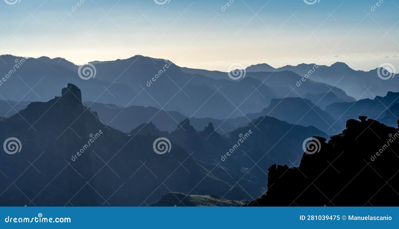 misty view of mountain layer silhouettes at caldera de tejeda, degollada de las palomas, gran canaria island, spain