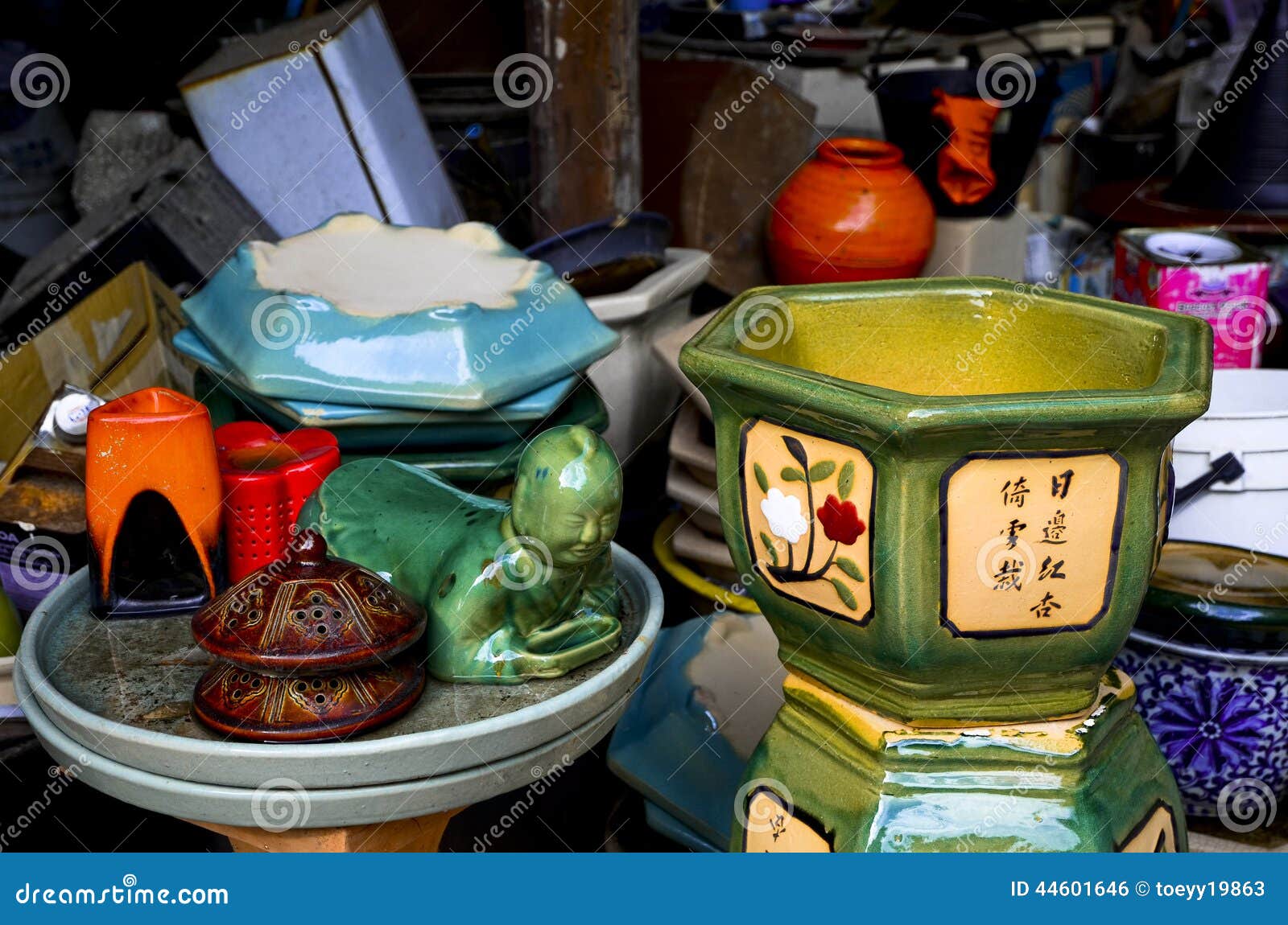 Mix of ceramic items stock photo. Image of orange, object 44601646