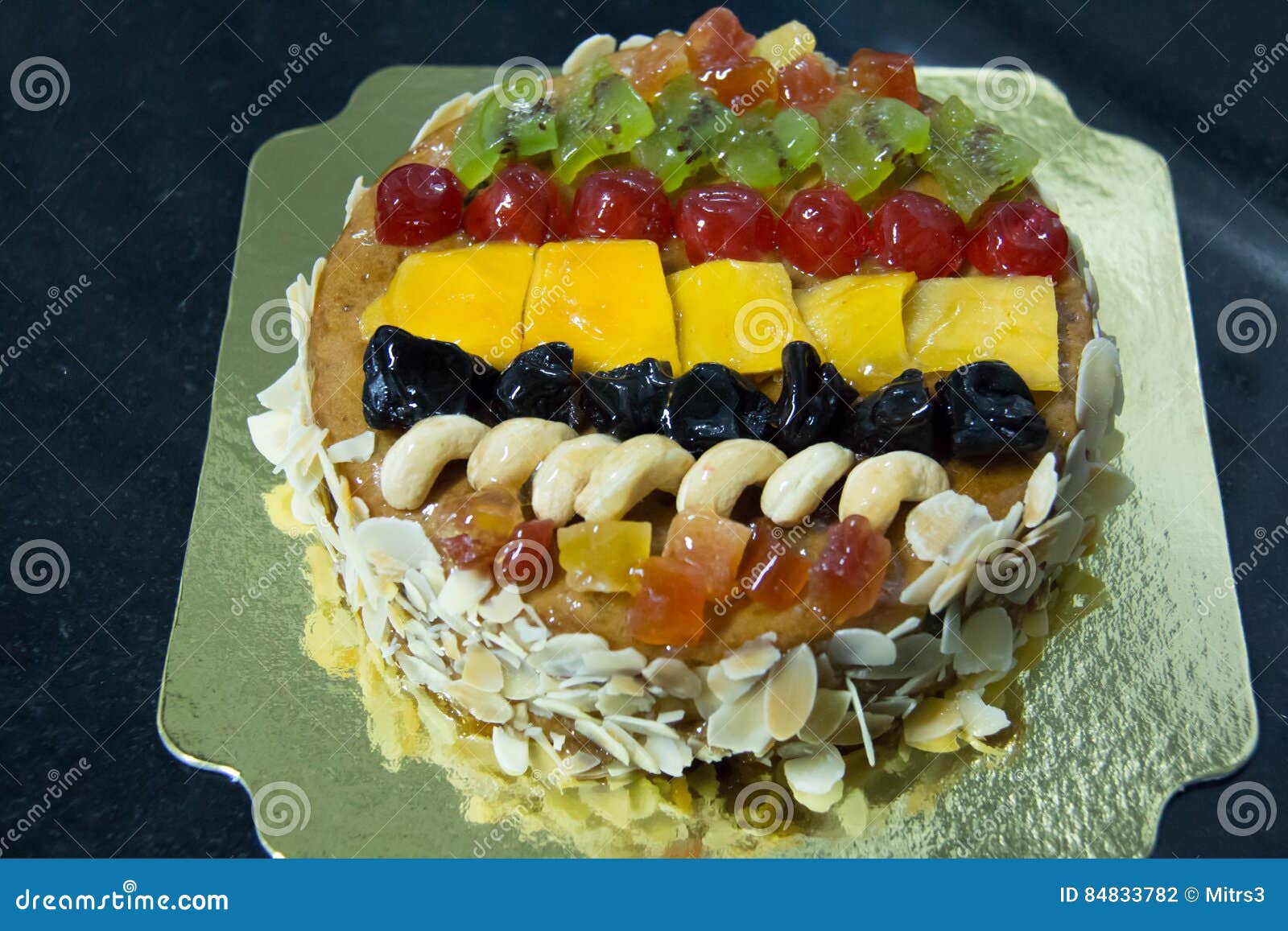 Mix Fruits Cake with Almond Nut and Dried Fruit. Stock Photo Image of