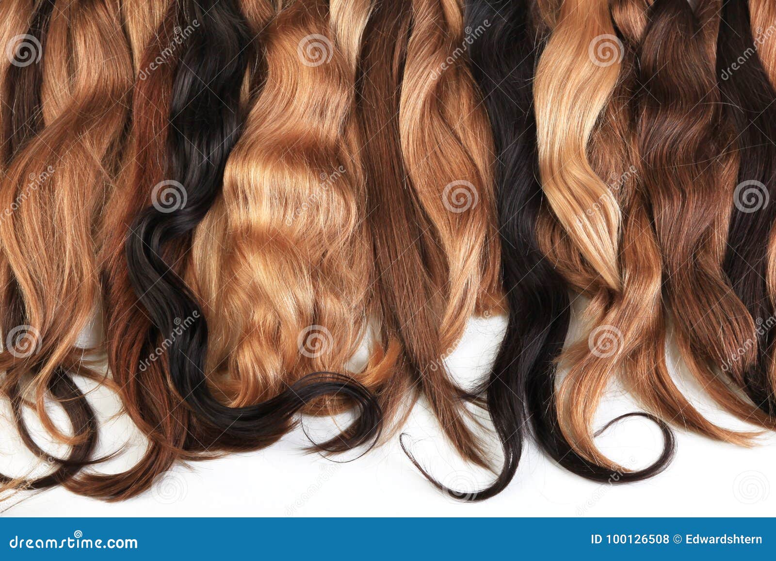 mix of natural extensions hair: blond, red, brown. strands of ha