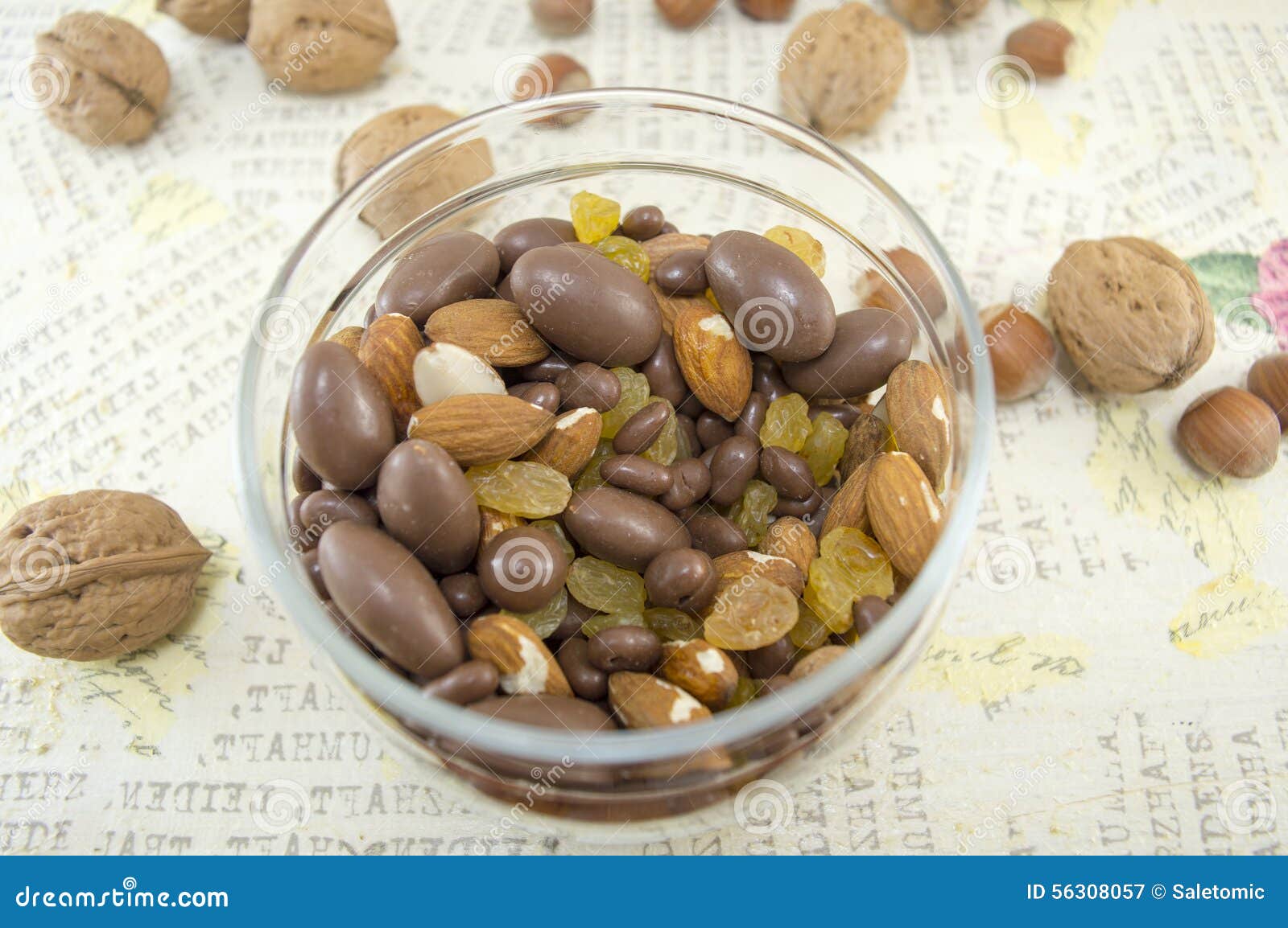 Mix of Nuts, Raisins,hazelnuts, Almonds and Chocolate in the Bowl Stock