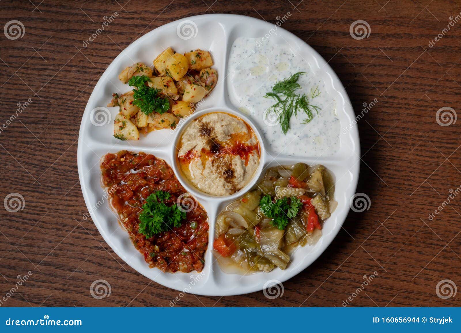 mix plate arabic food with vegetarian spread starters on wooden background