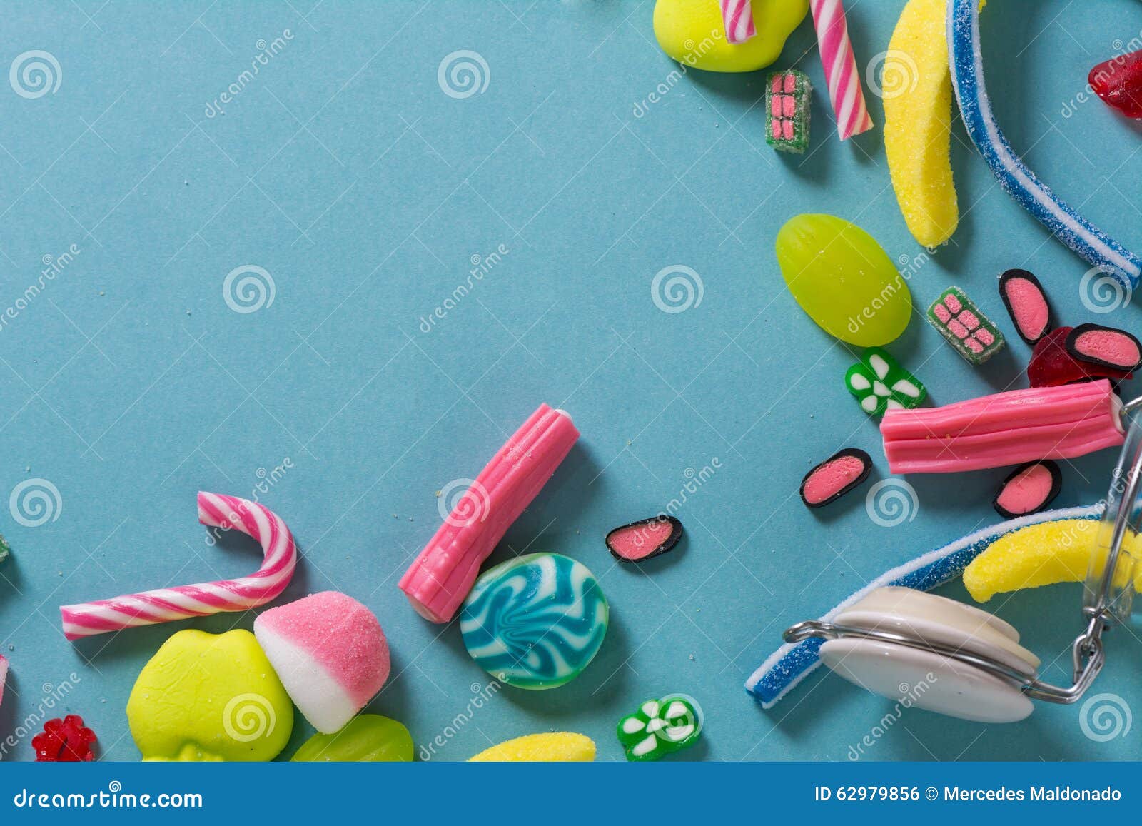 Mixed Colorful Candy on Blue Background, Kids Holidays Stock Photo