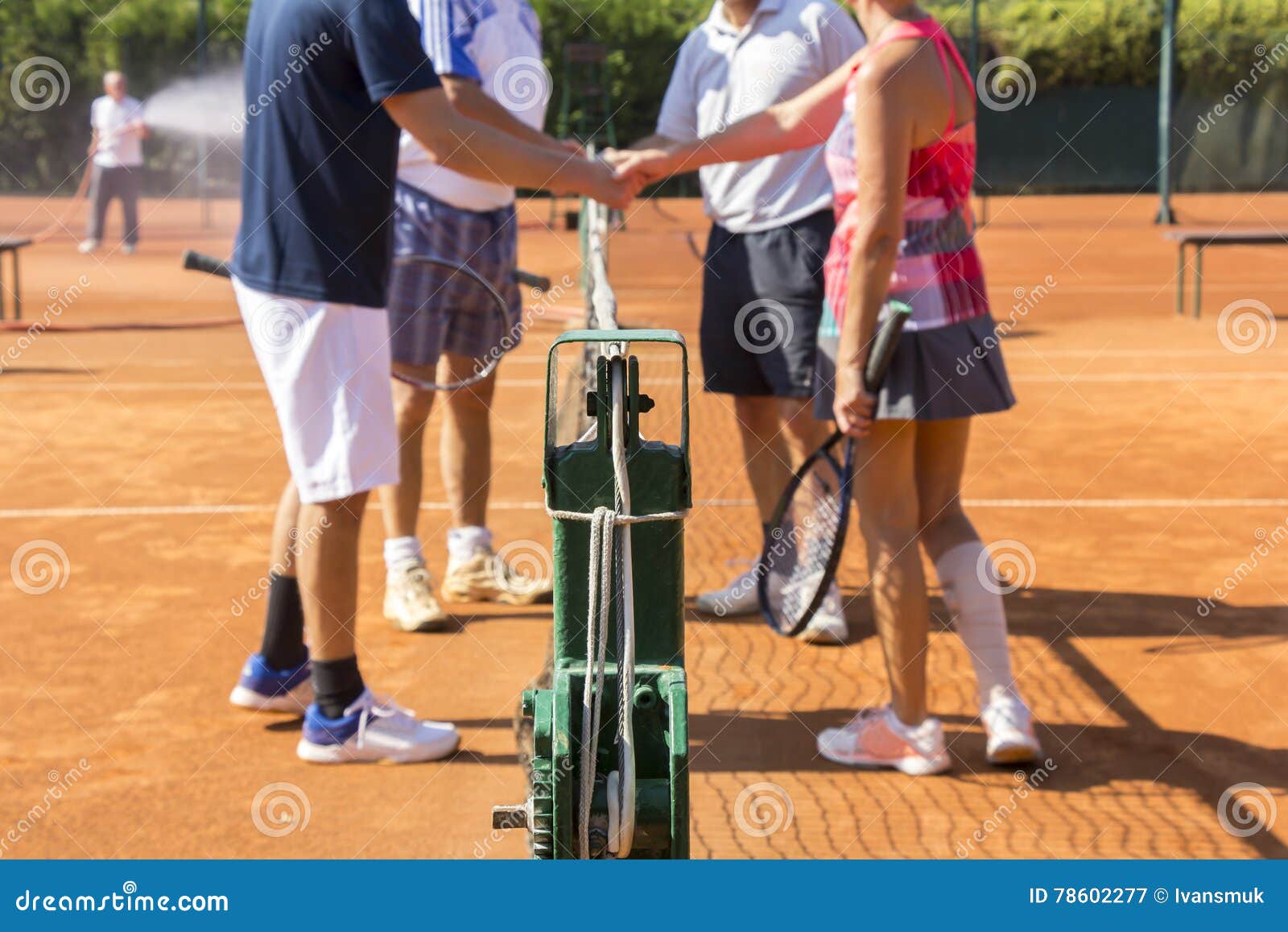 Mixed Doubles Tennis Players Shake Hands before and after the Te Stock