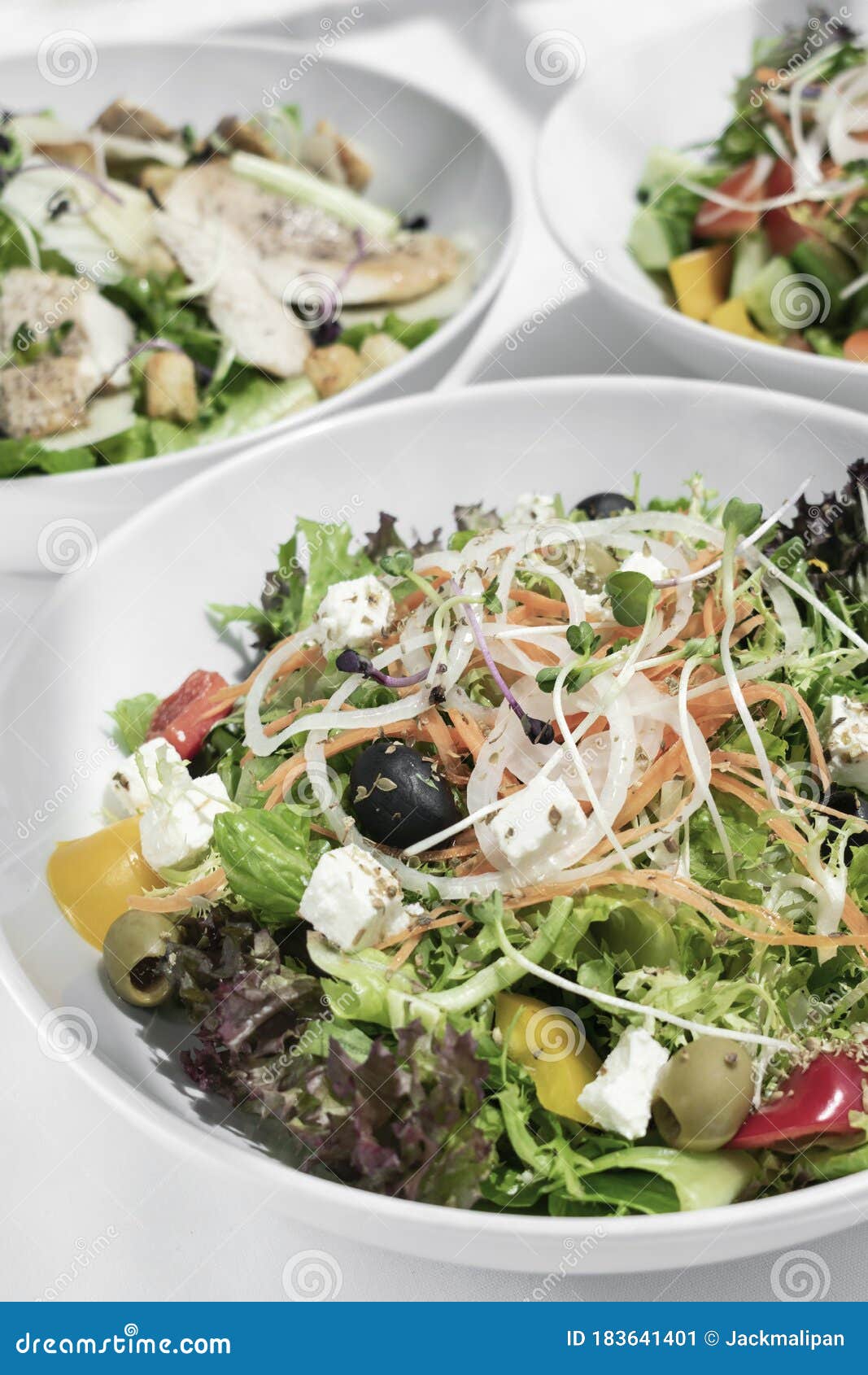 Mixed Fresh Organic Salads on White Restaurant Table Stock Image