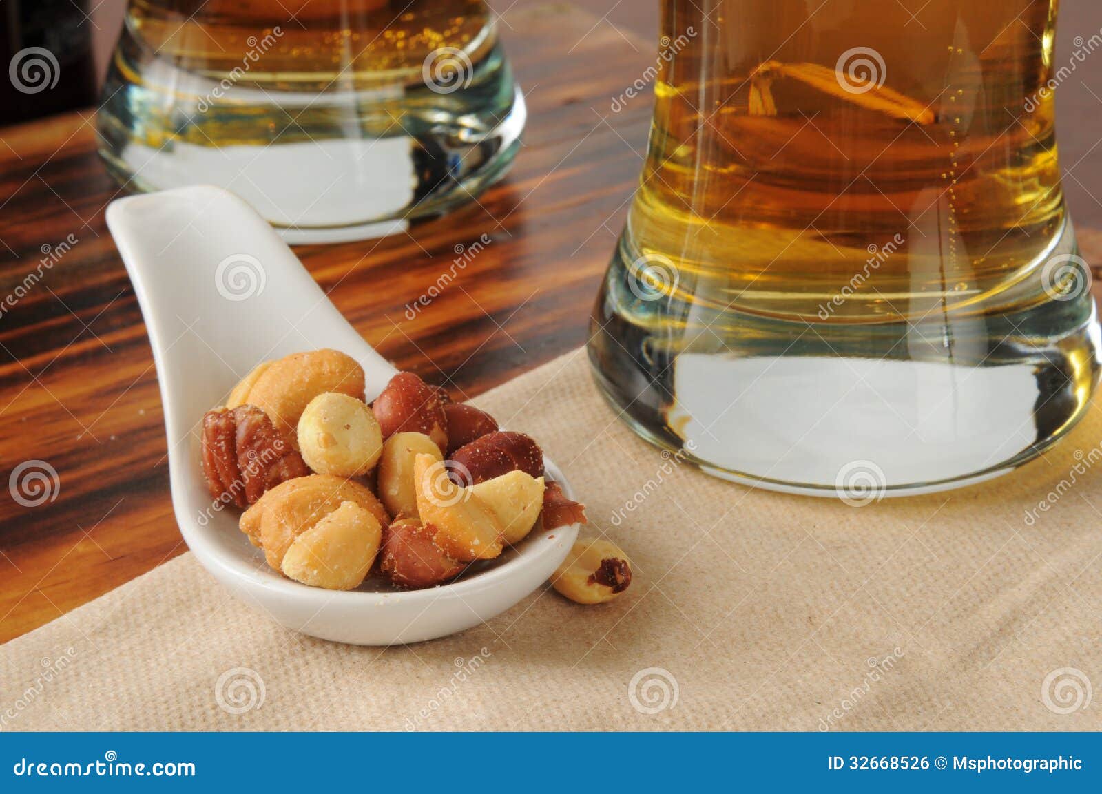 Mixed nuts and beer stock photo. Image of cashews, glasses 32668526
