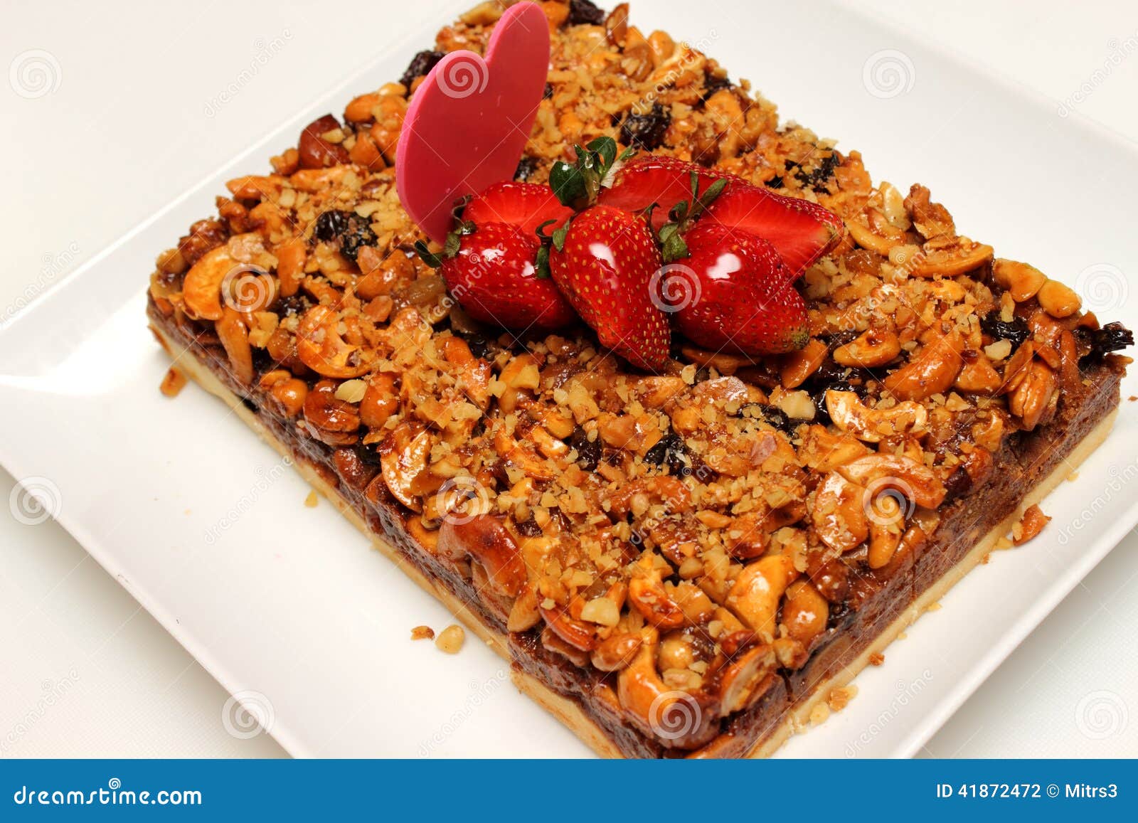 Mixed Nuts Pie Decorated with Strawberry. Stock Photo Image of