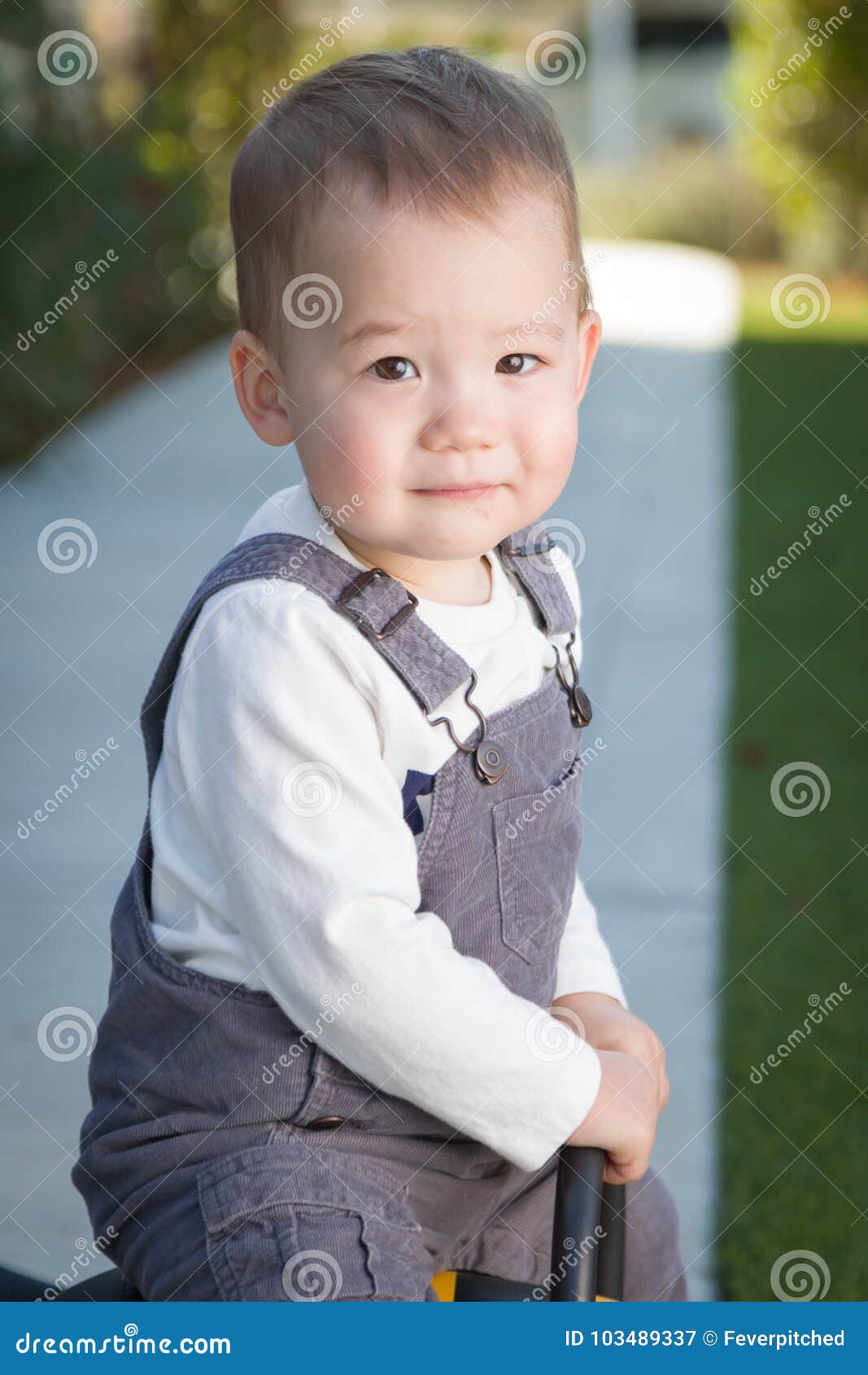 Mixed Race Chinese and Caucasian Baby Boy Having Fun Outdo Stock