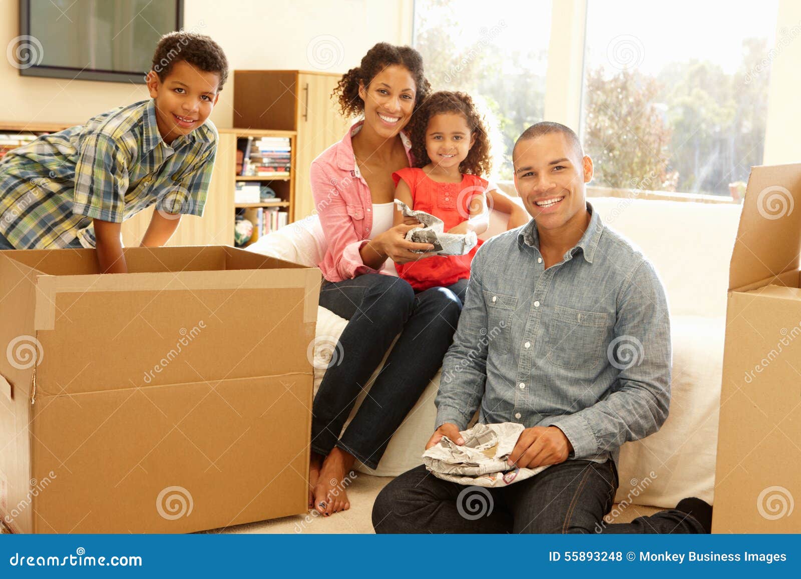 Mixed Race Family in New Home Stock Photo - Image of mixed, estate