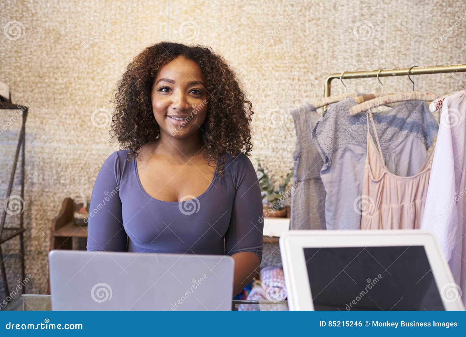 Mixed Race Sales Assistant at the Counter of Clothing Store Stock Photo Image of horizontal