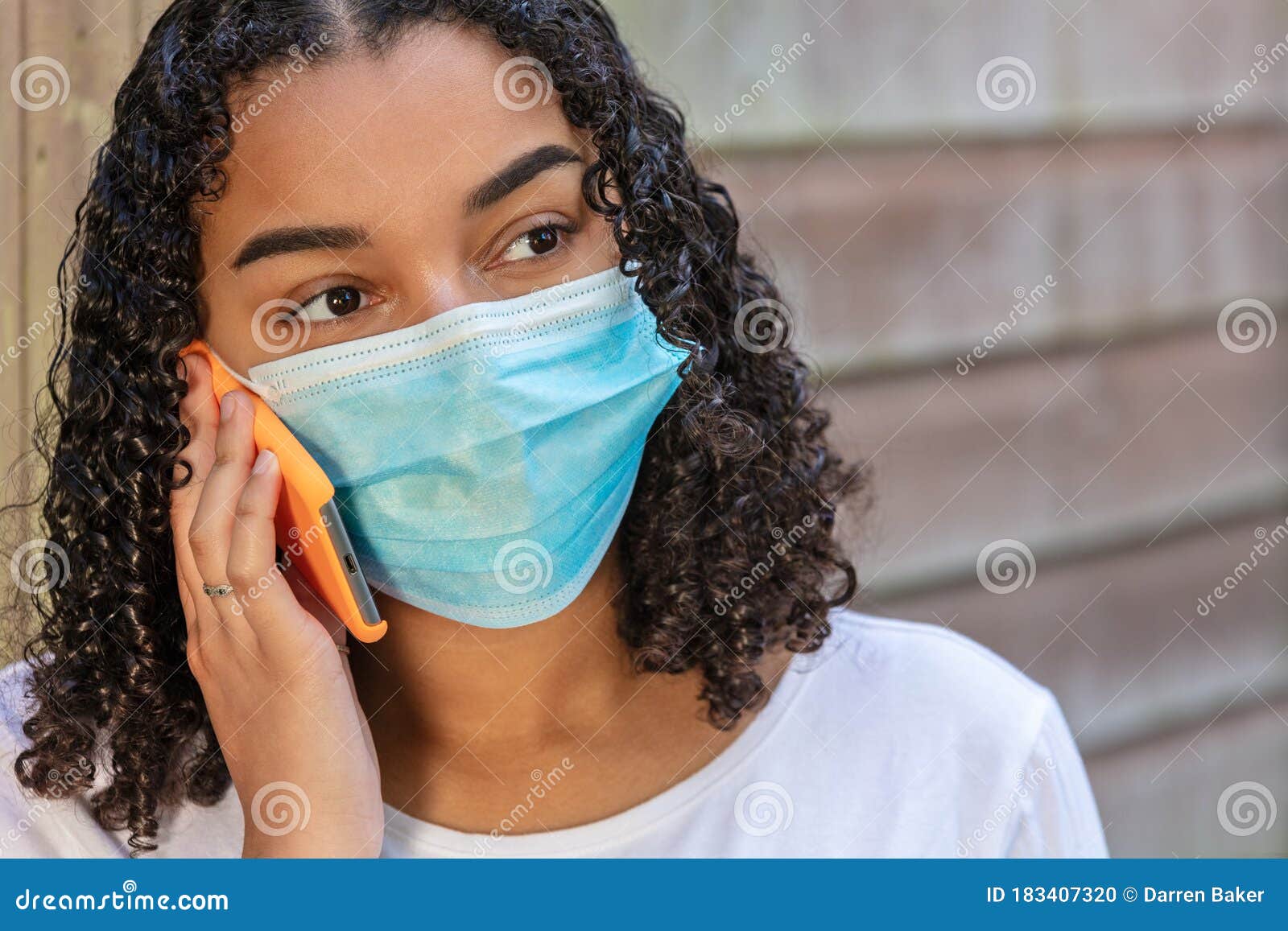 Mixed Race Teenager Girl Woman Wearing Face Mask Talking on Cell Phone ...