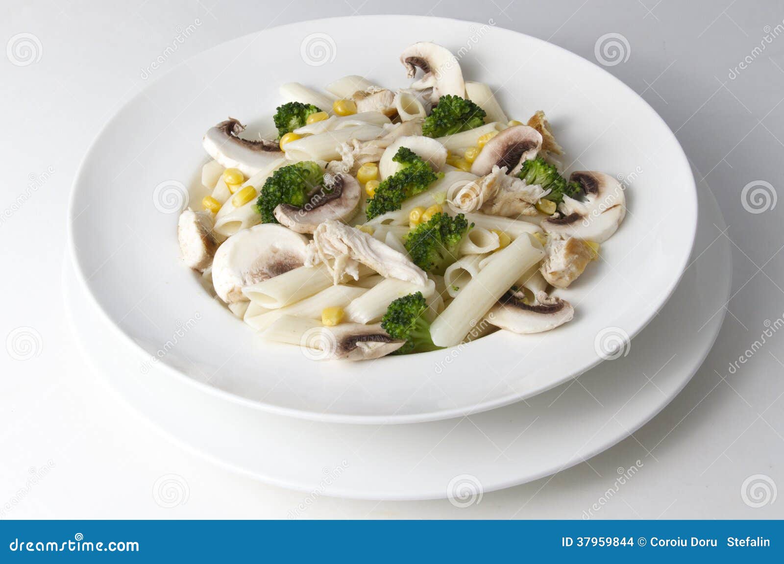 Mixed Salad with Eggs, Pasta, Mushrooms and Chicken Meat Stock Photo