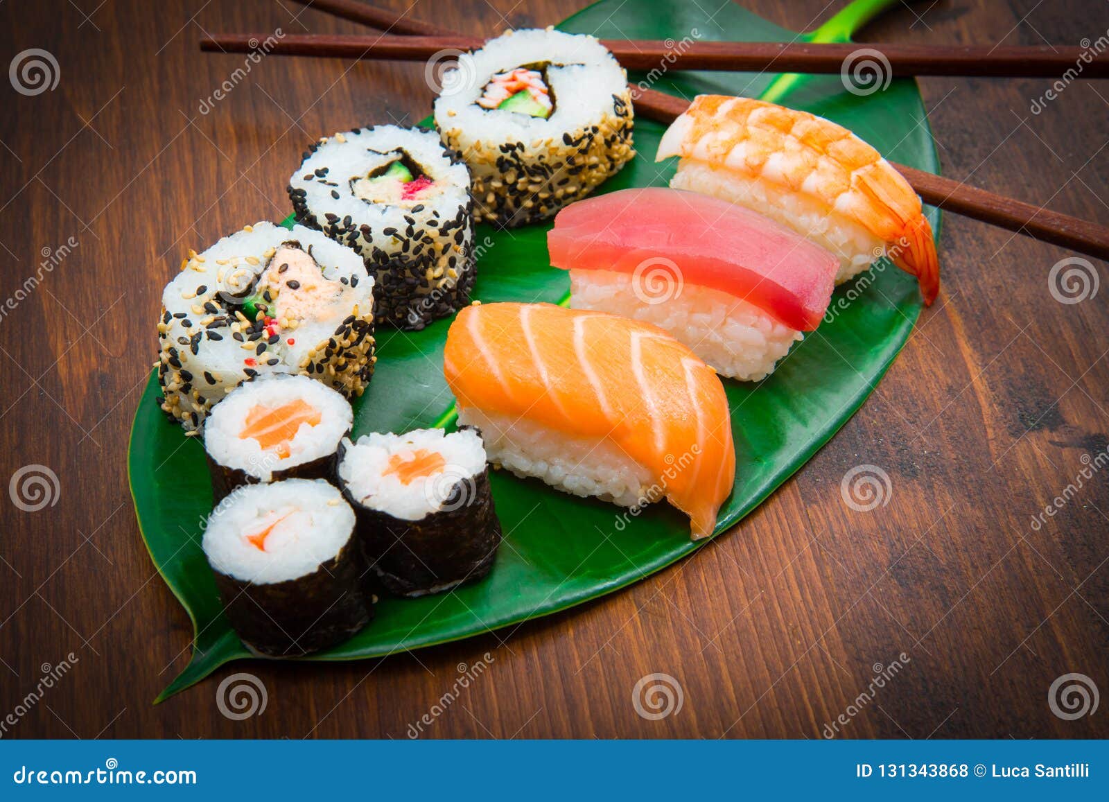 Mixed sushi on green leaf stock photo. Image of meal 131343868