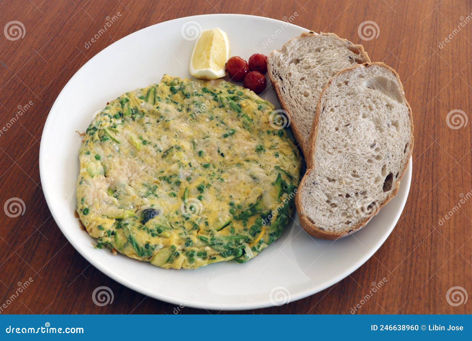 Mixed Vegetable Eggs Omelette with Tomatoes, Bread Slice Stock Photo