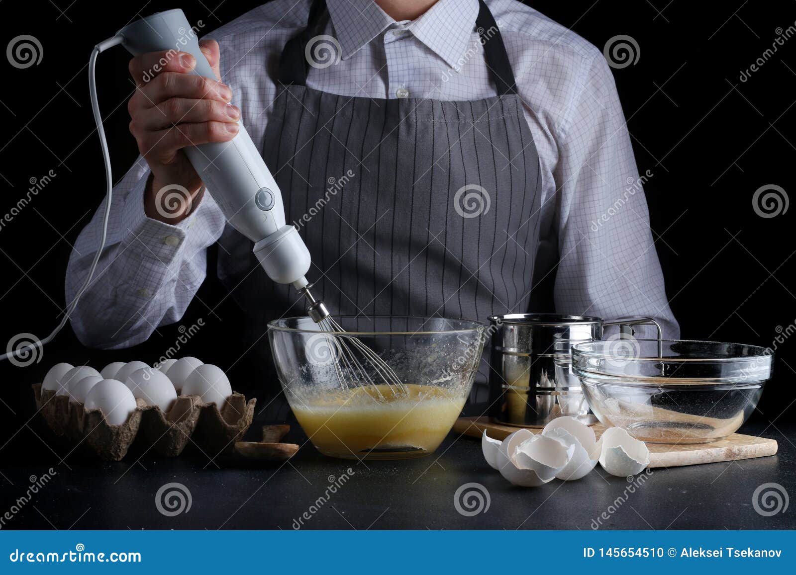 Mixer and Dough. Recipe of Pie or Cake Concept on Dark Stock Photo