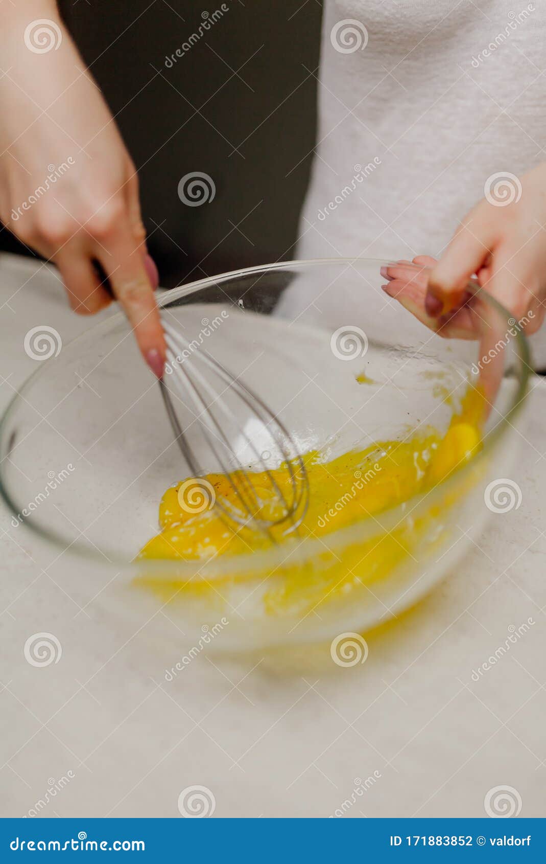 Mixing eggs in glass bowl stock photo. Image of dough 171883852