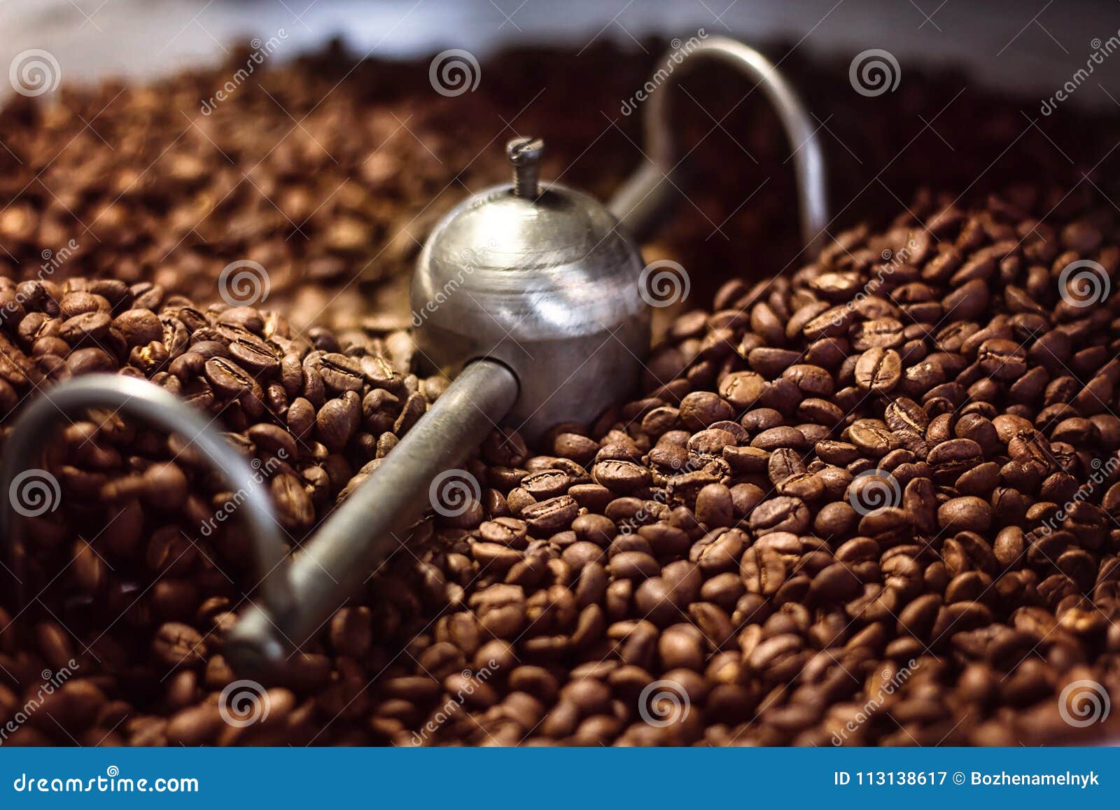 Mixing Roasted Coffee Closeup. a Batch of Freshly Roasted Aromatic