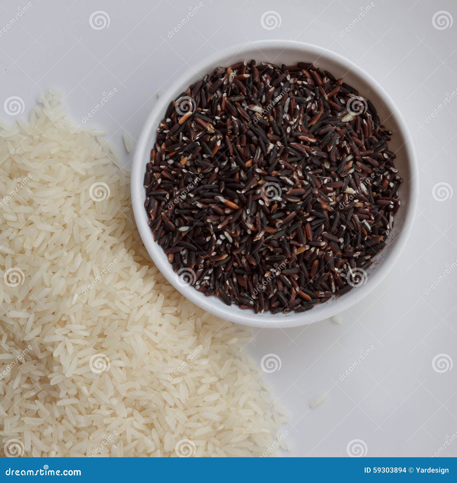 Mixture of Dark Brown and White Rice on Two White Plates Stock Photo