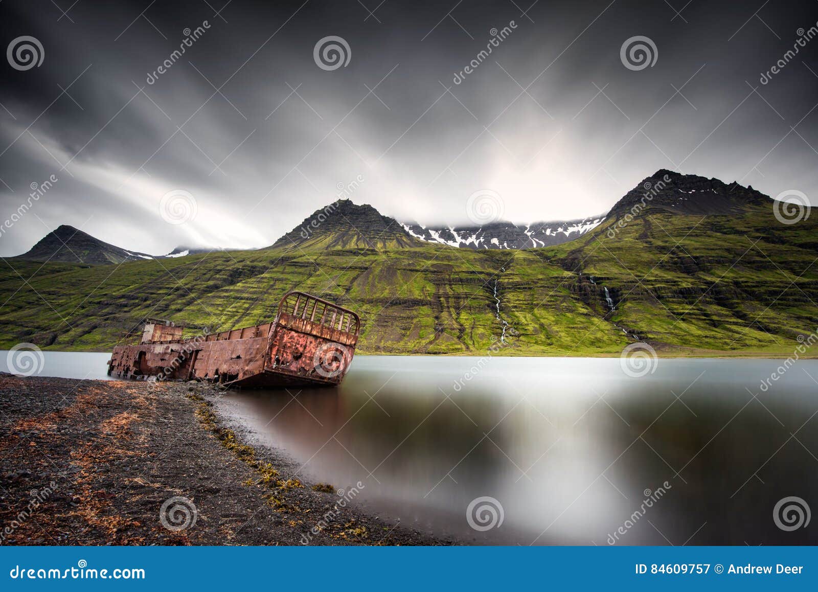 mjoifjordur, iceland - abandoned fishing boat rusts in fjord