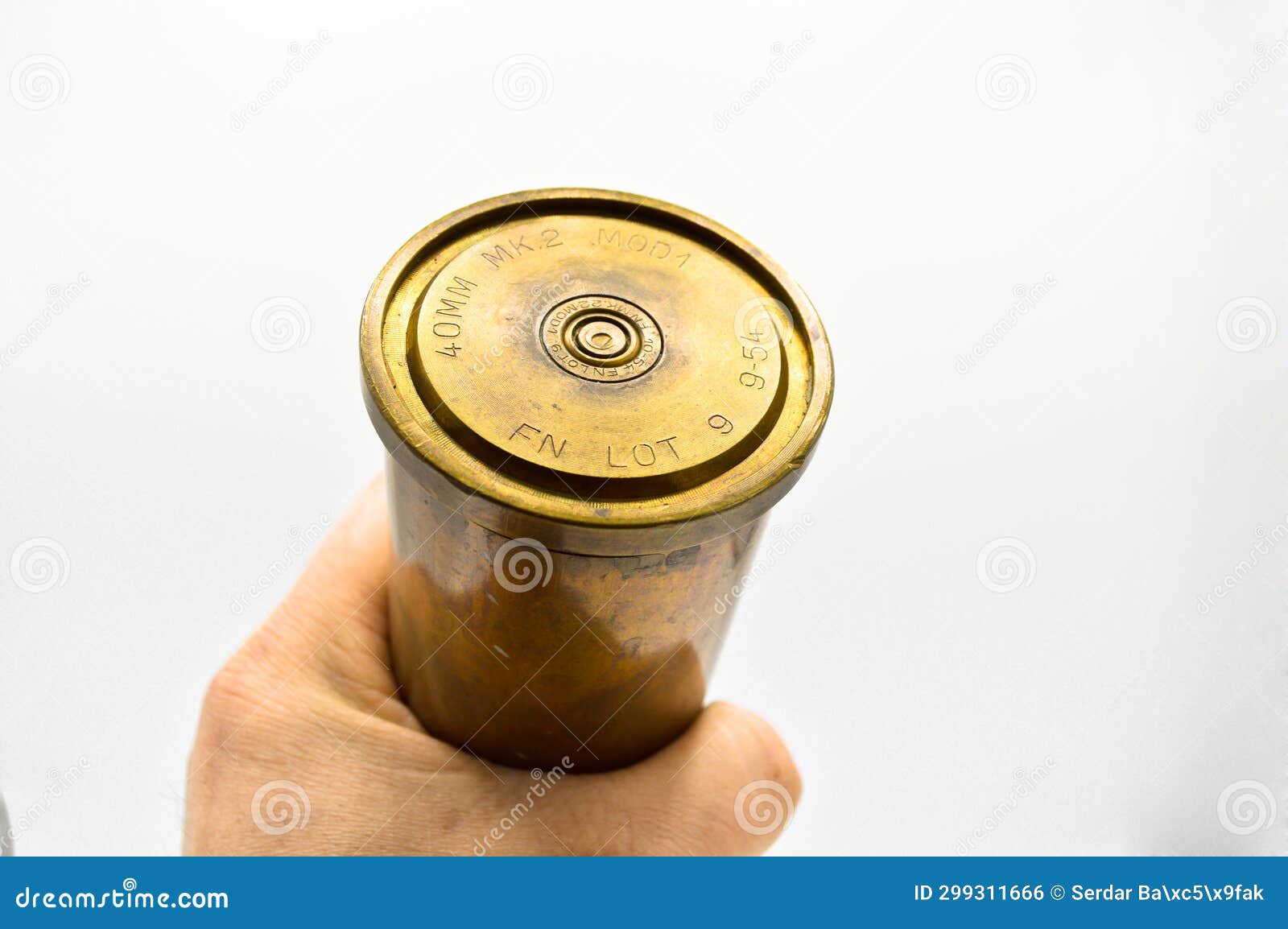 40 Mm Anti-aircraft Bullet Empty Casing Made of Brass Metal and Hand,  Isolated on White Background Stock Photo - Image of cannonball, firearm:  299311666