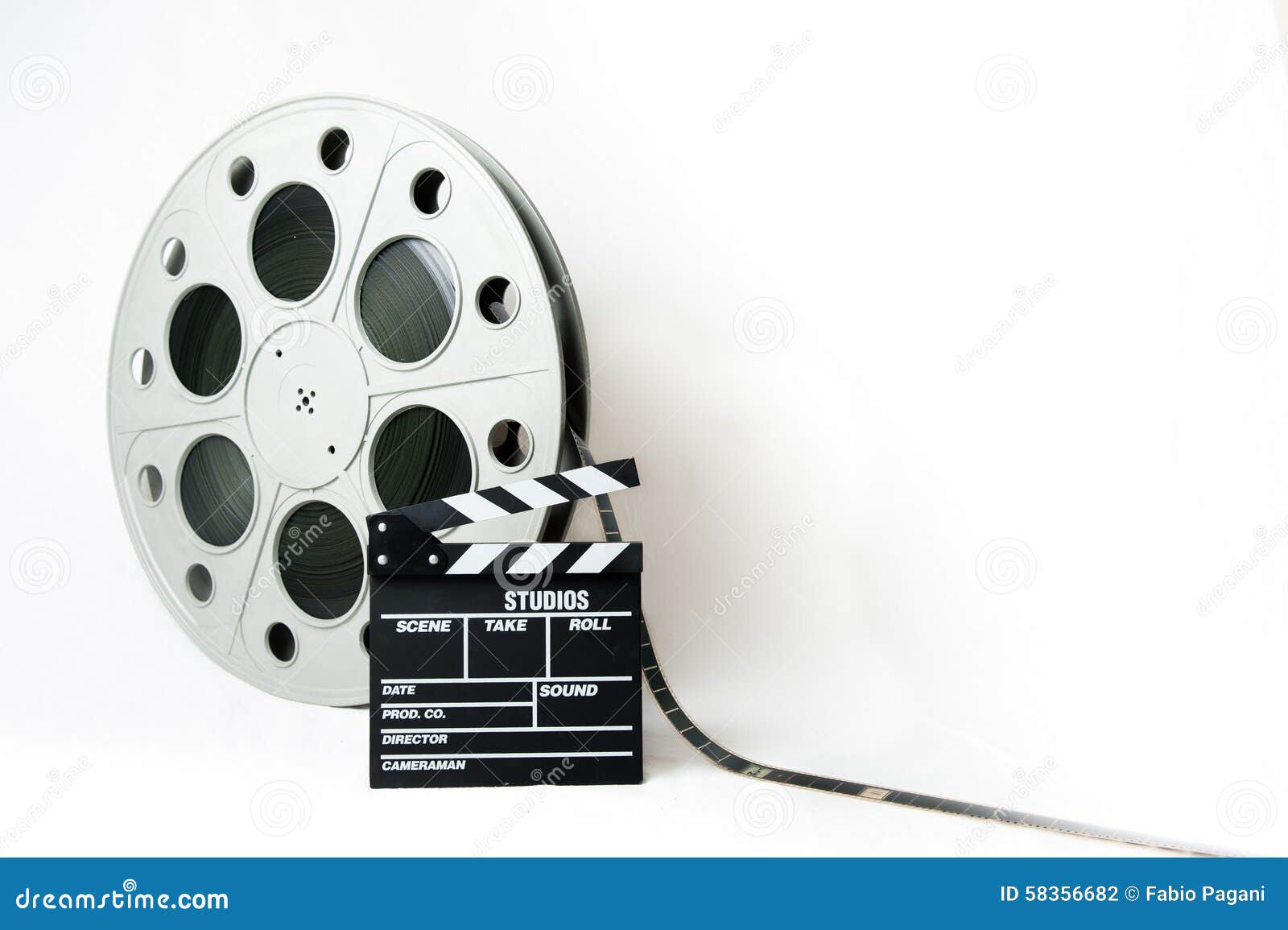 35mm Cinema Big Reel with Film and Movie Clapperboard Stock Photo