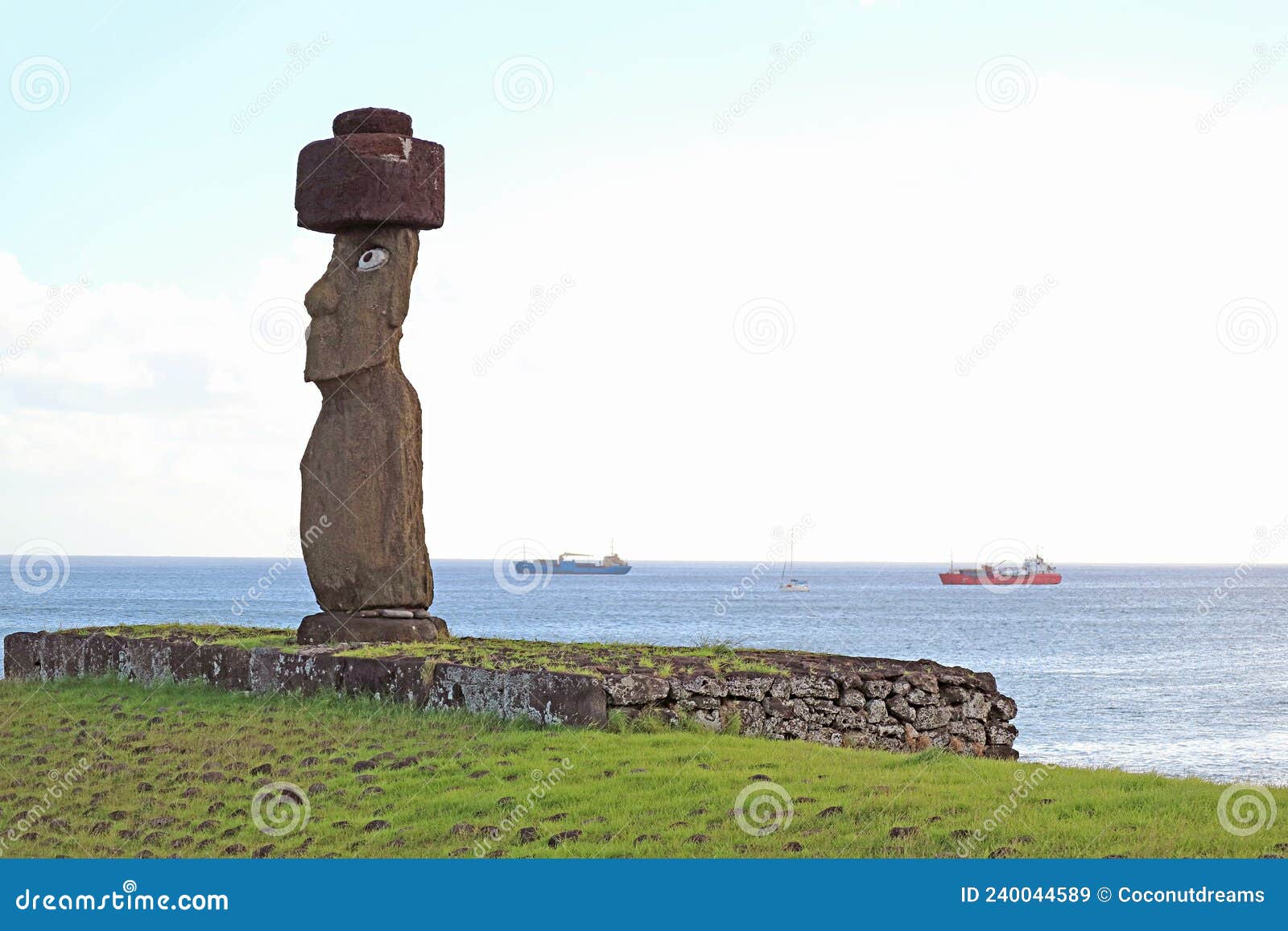 the moai with pukao hat of ahu ko te riku ceremonial platform, with pacific ocean in the backdrop,, easter island, chile