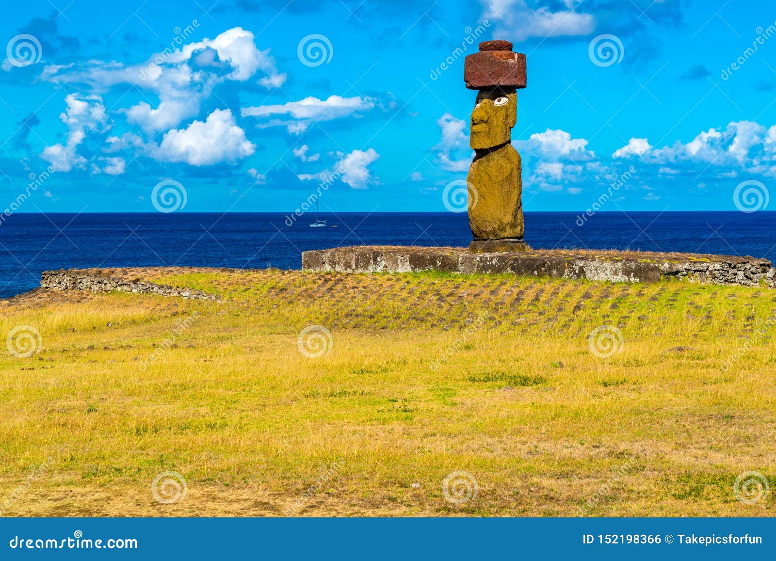 moai with red pukao or red hat at ahu ko te riku on easter island