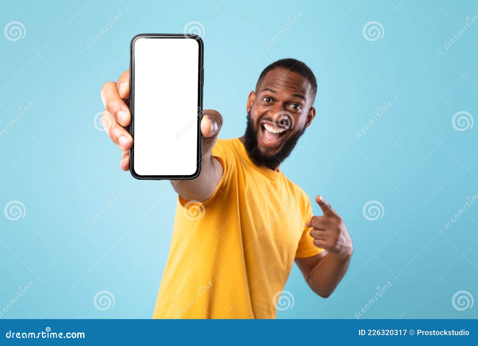 mobile app advertisement. excited black man pointing at smartphone with empty screen, mockup. space for ad or website