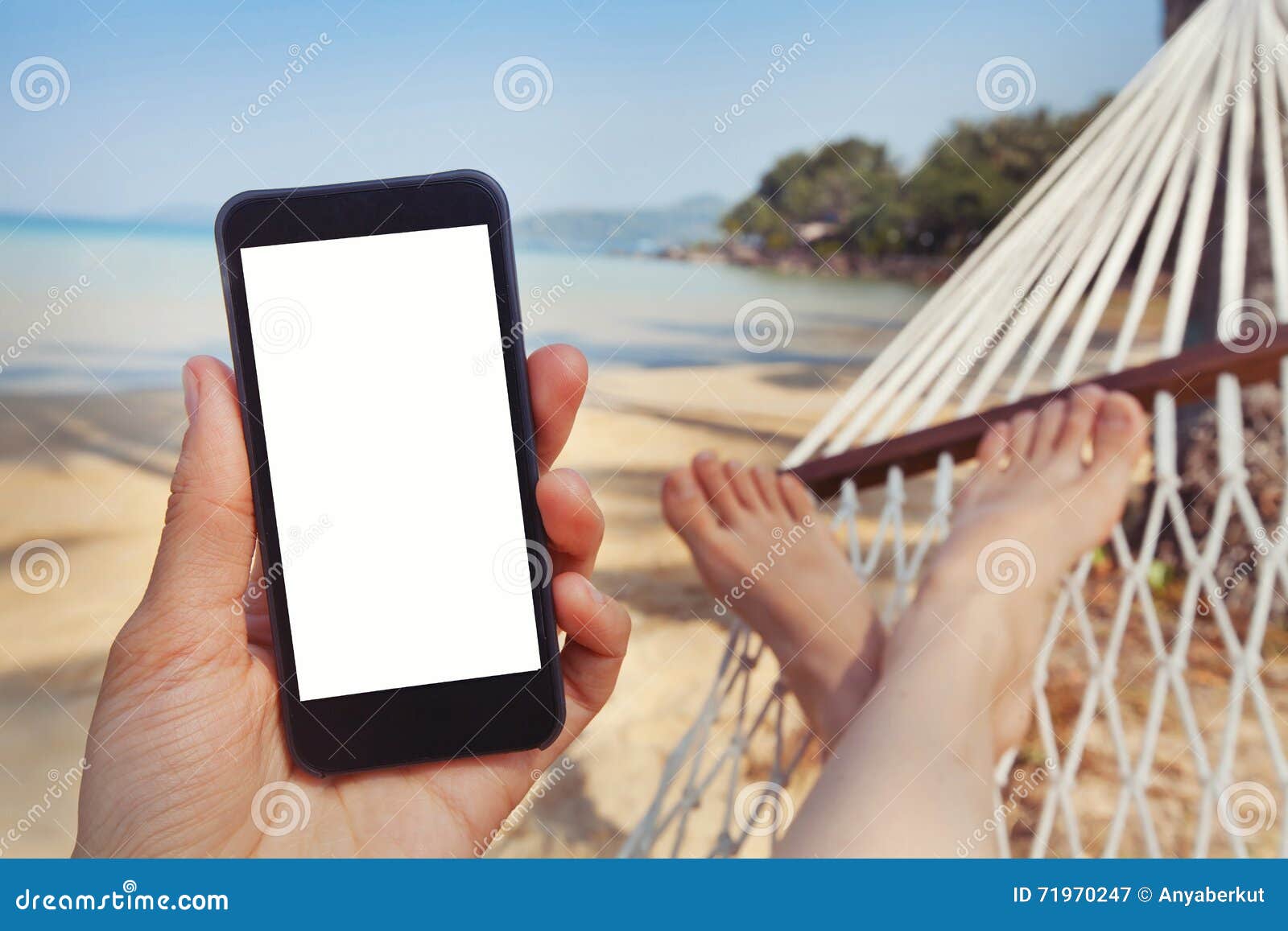 mobile application for travels, phone in hand, beach