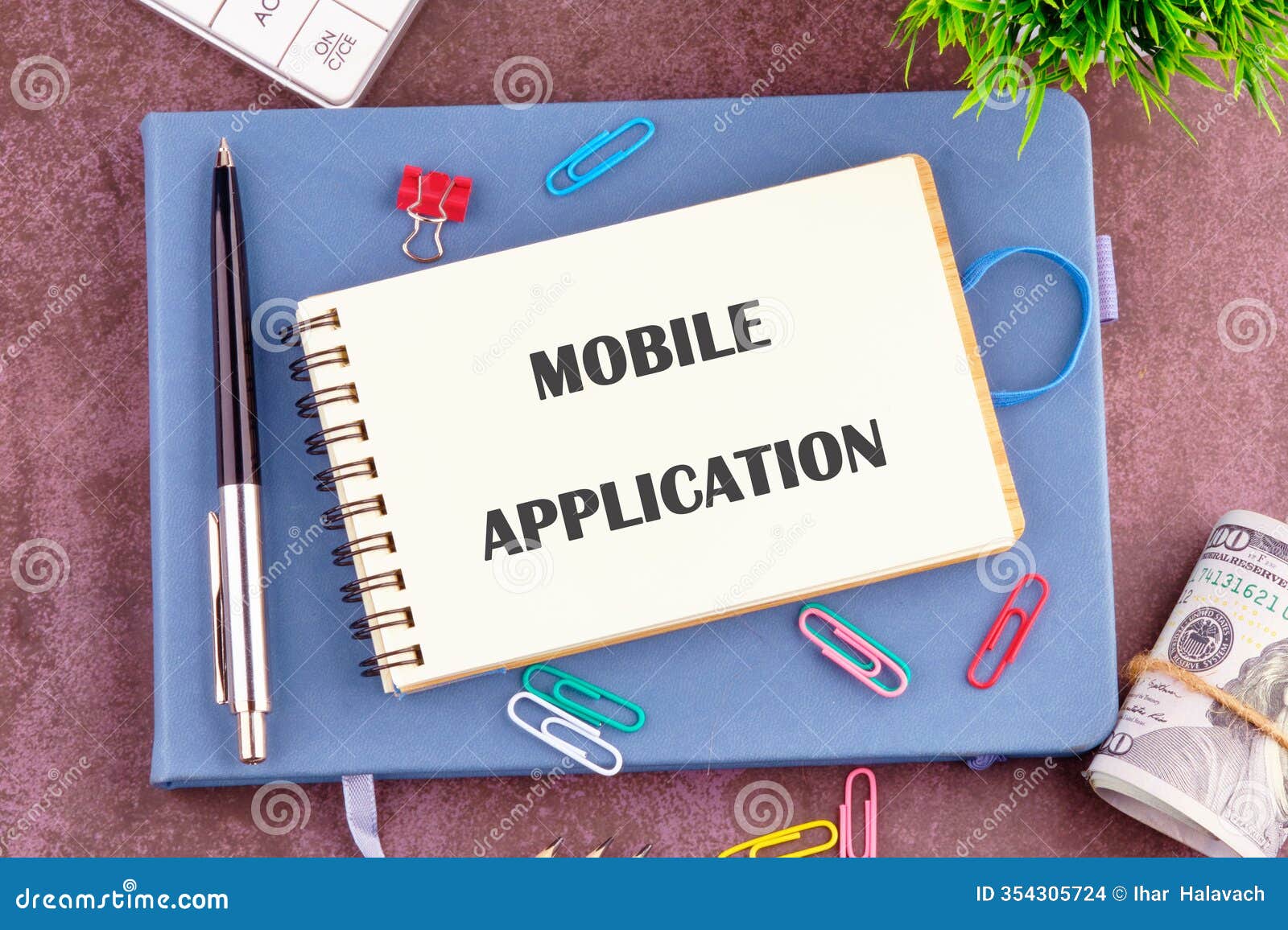 mobile application words in the notebook, top view. copy space