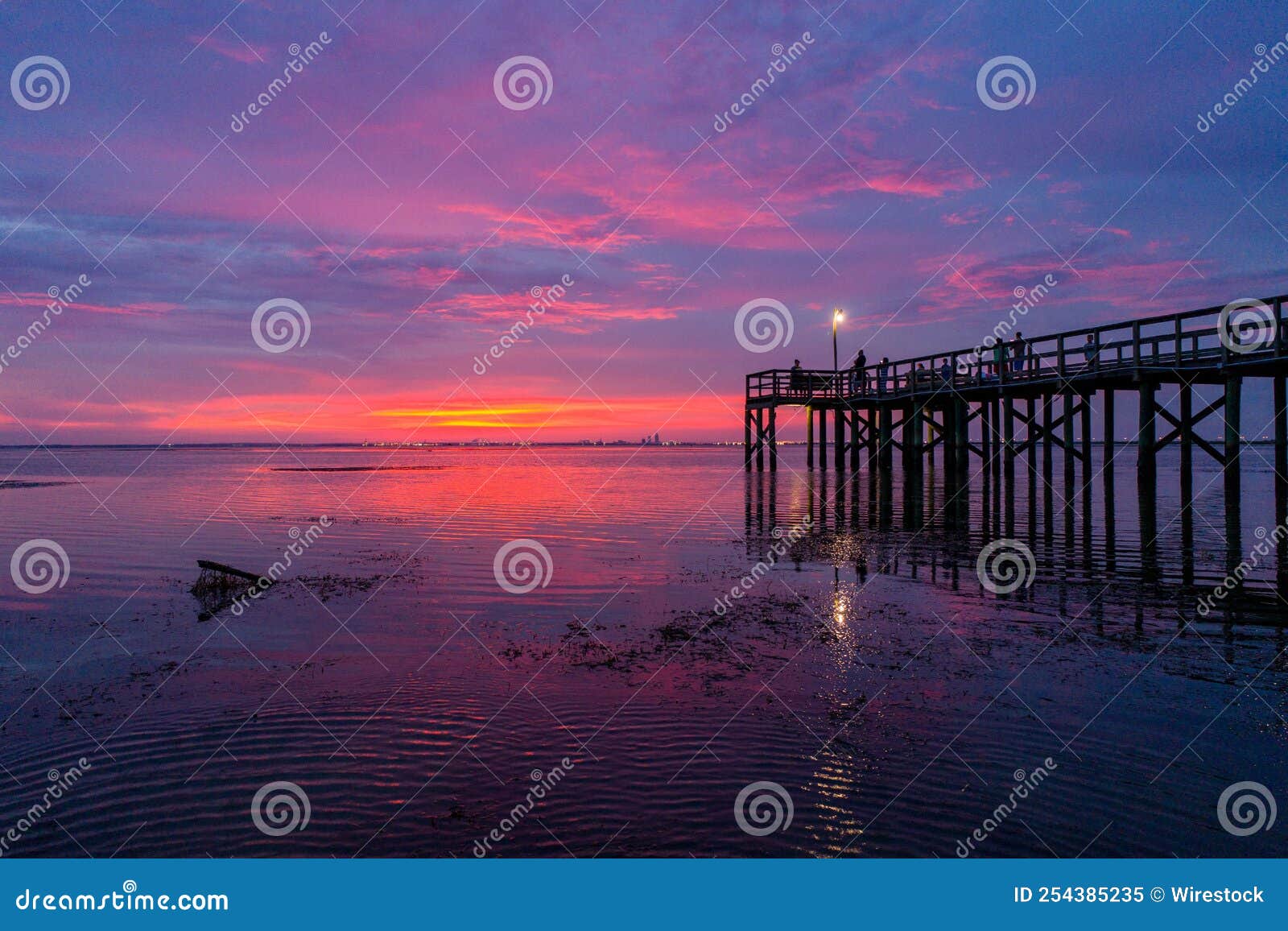 Mobile Bay at sunset stock image. Image of coast, beach 254385235
