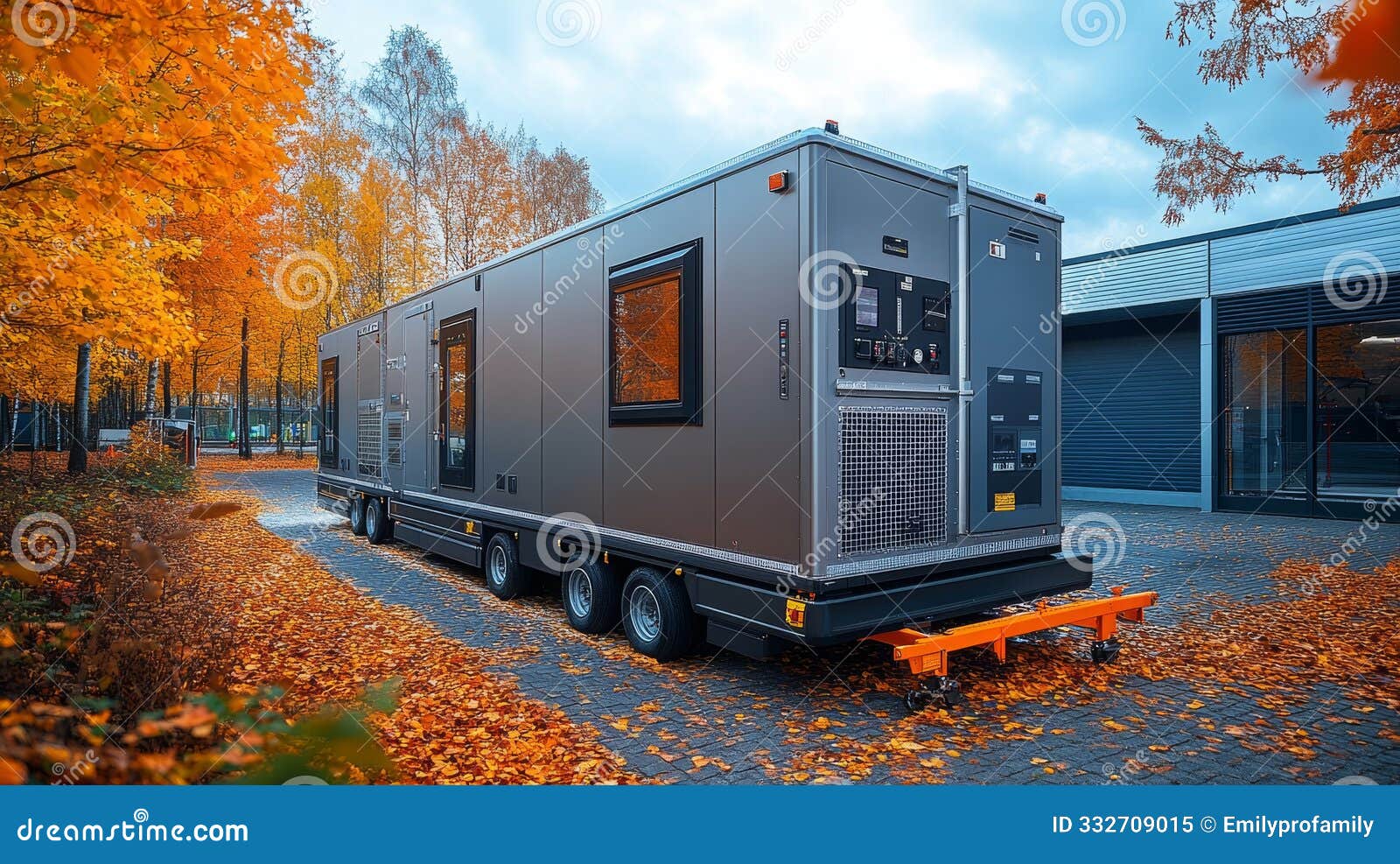 mobile ccs unit positioned in an autumn landscape near a modern building