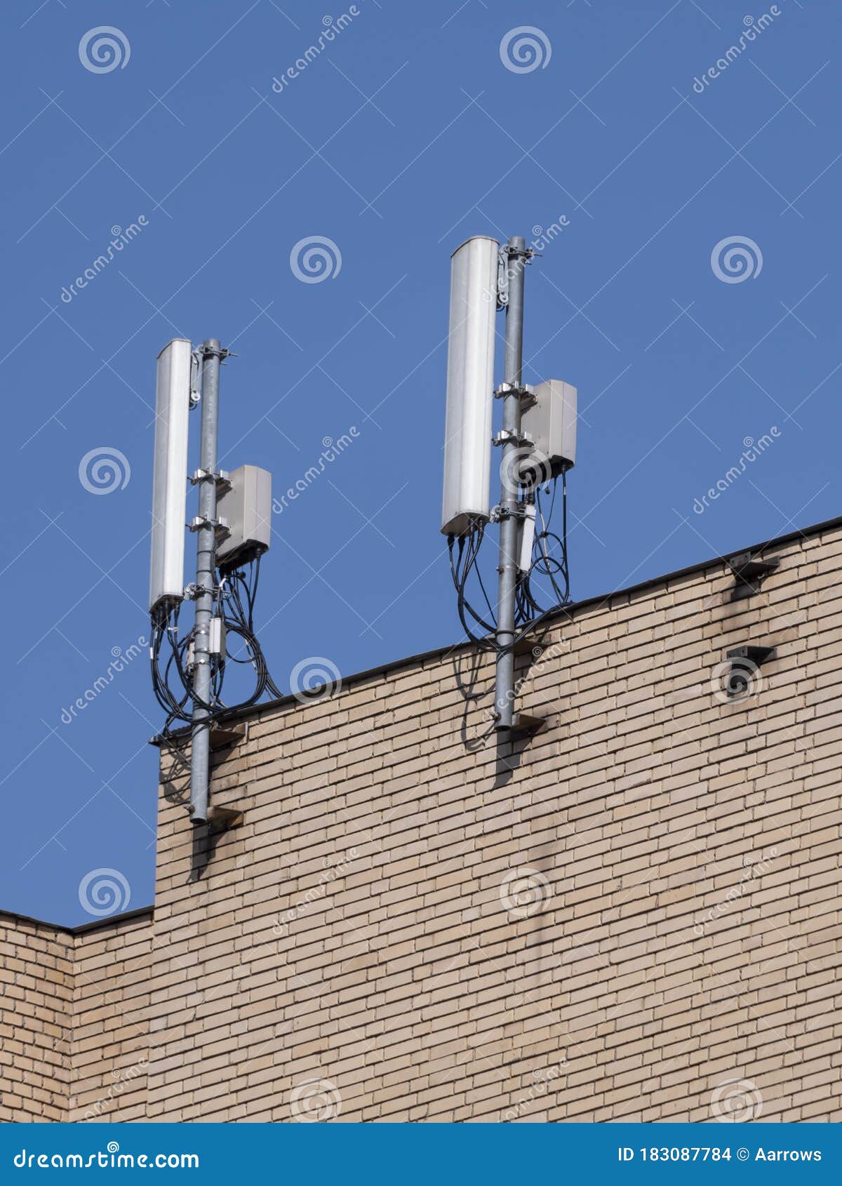 Mobile Communication Antennas on the Wall of a Building Stock Photo