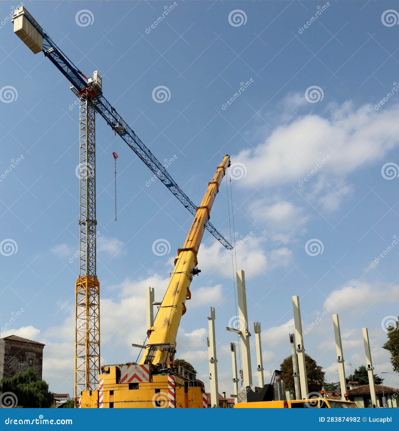 Mobile Crane Installing the Main Pillars of the New Building Stock