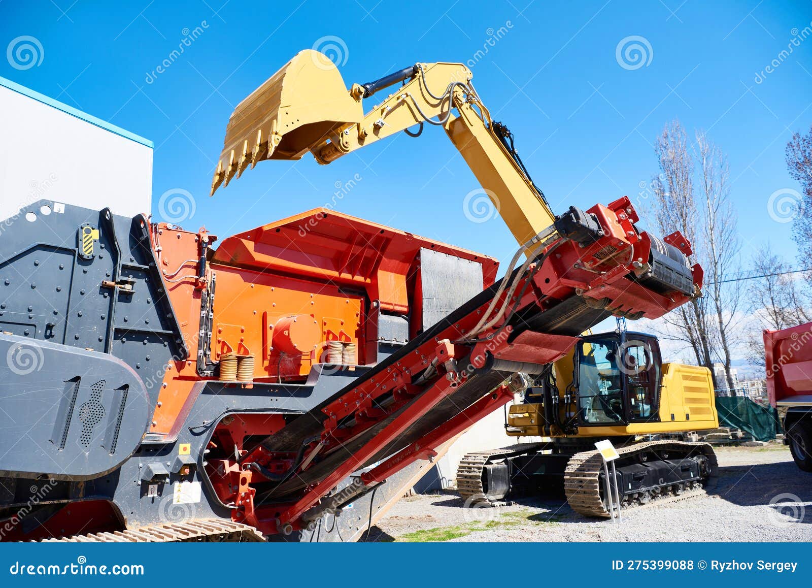 Mobile Impact Crusher and Bucket Excavator Stock Photo Image of