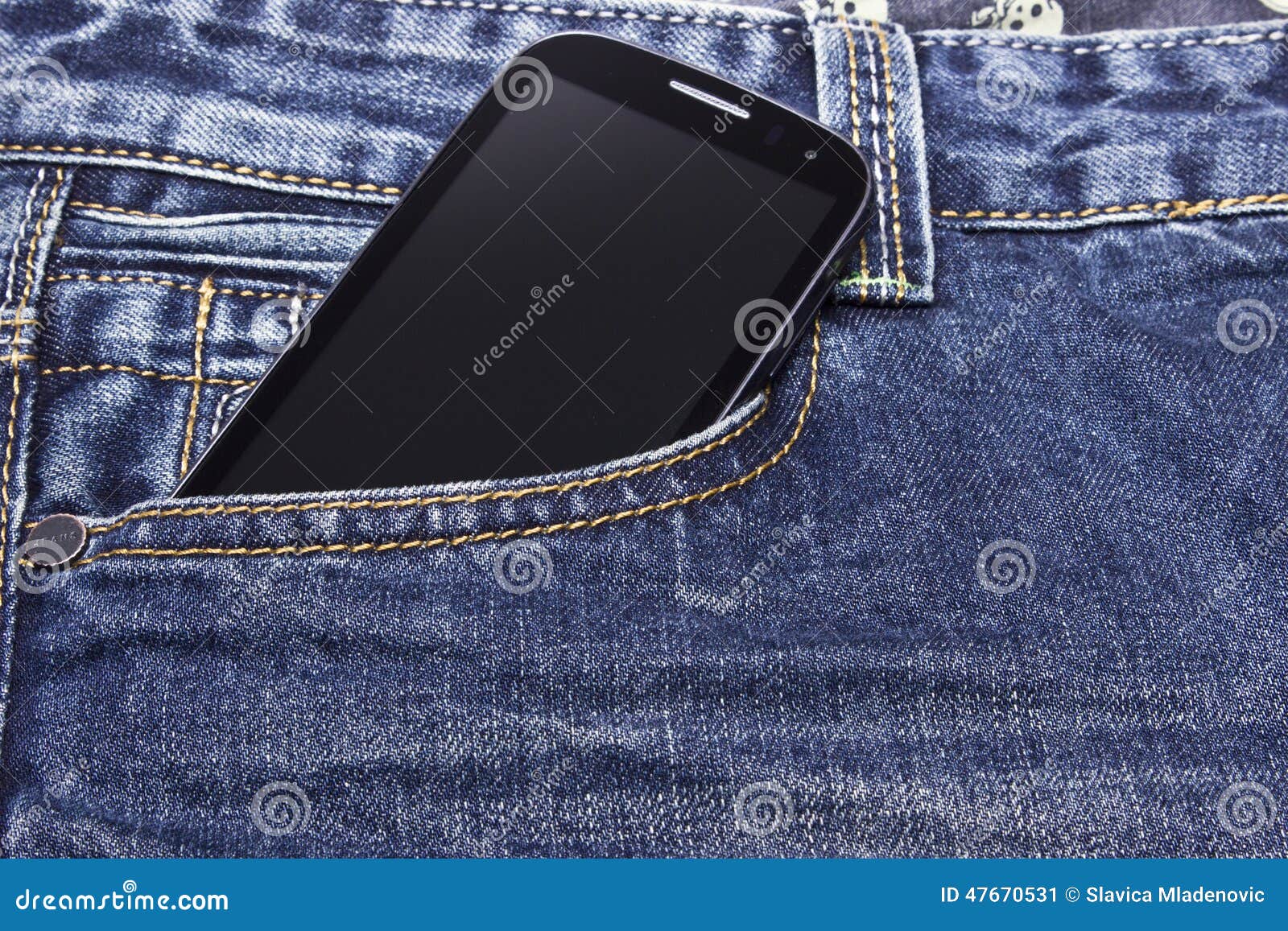 Mobile phone in blue jeans stock image. Image of textile 47670531