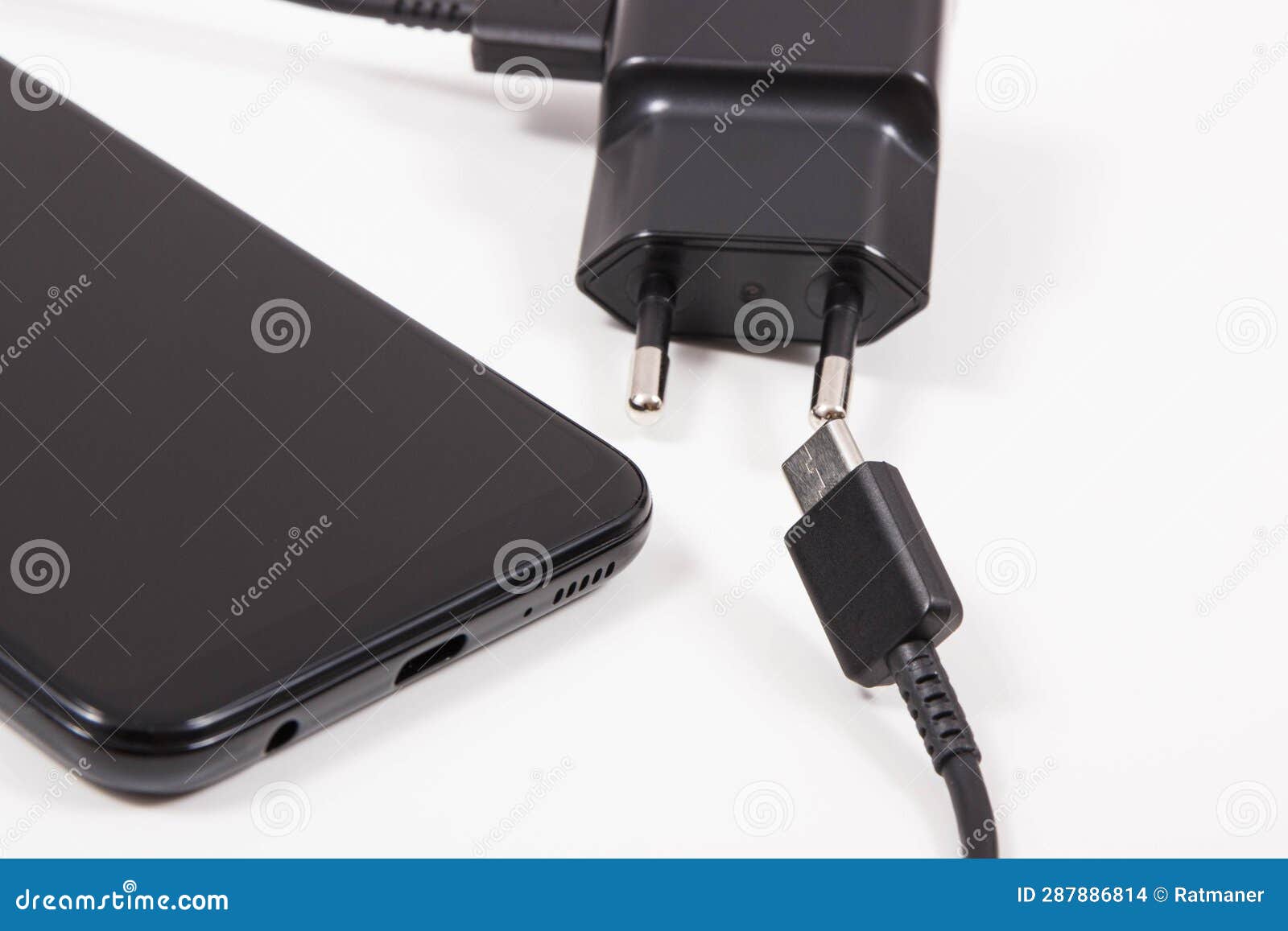 Mobile Phone and Charger with Plug. Smartphone Charging Stock Photo