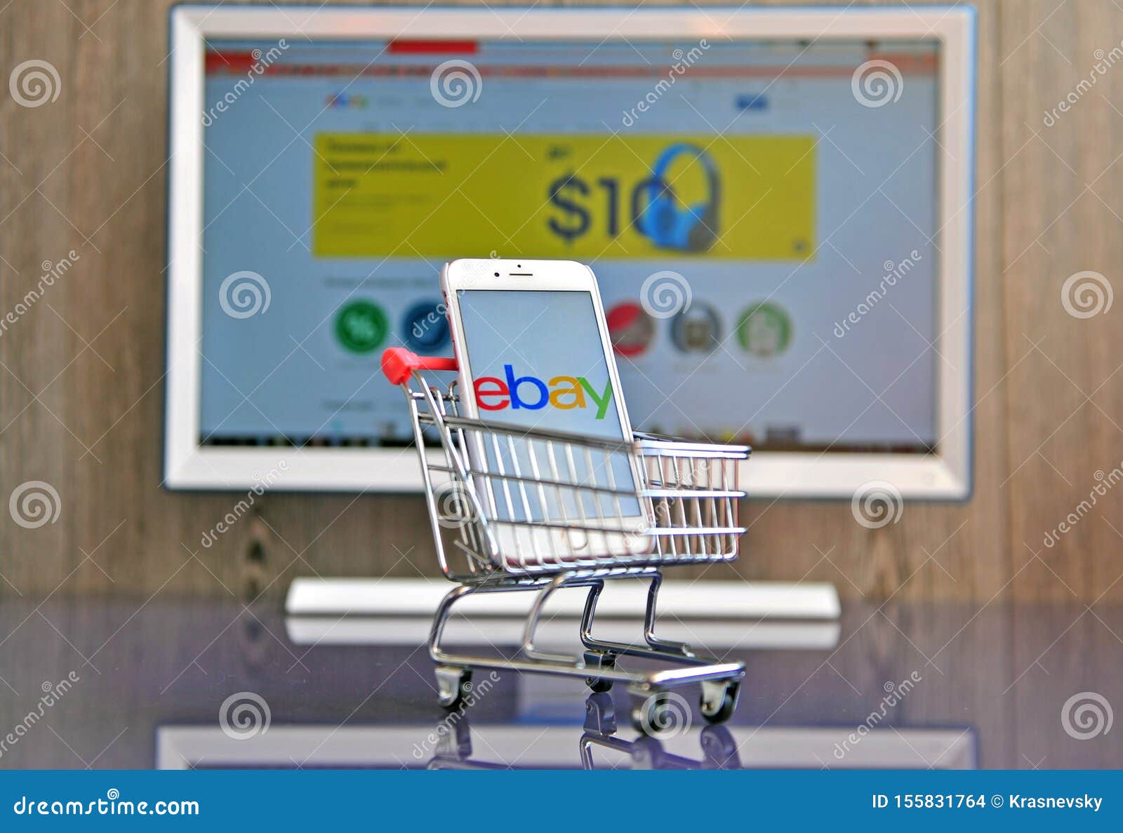 Mobile Phone and Computer Screen with Logo of Ebay Editorial Stock