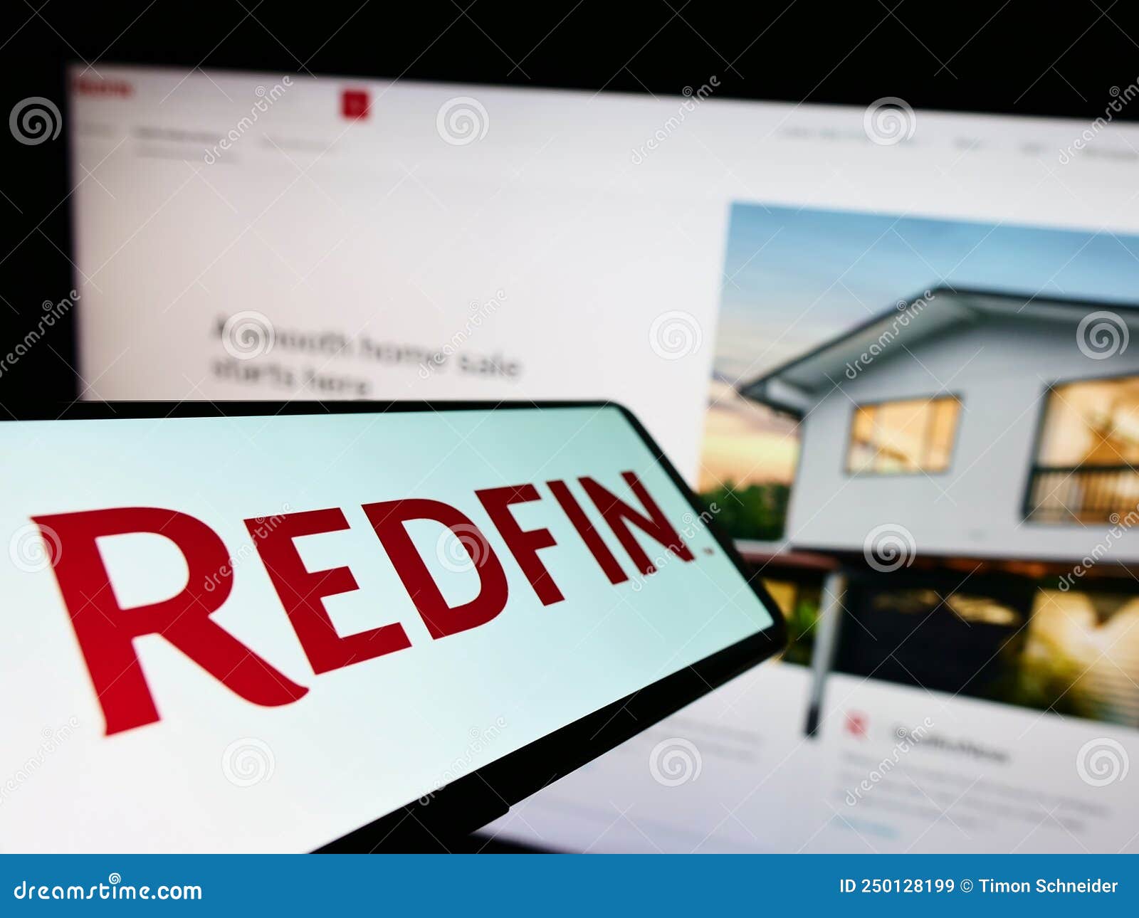 Mobile Phone with Logo of American Real Estate Company Redfin