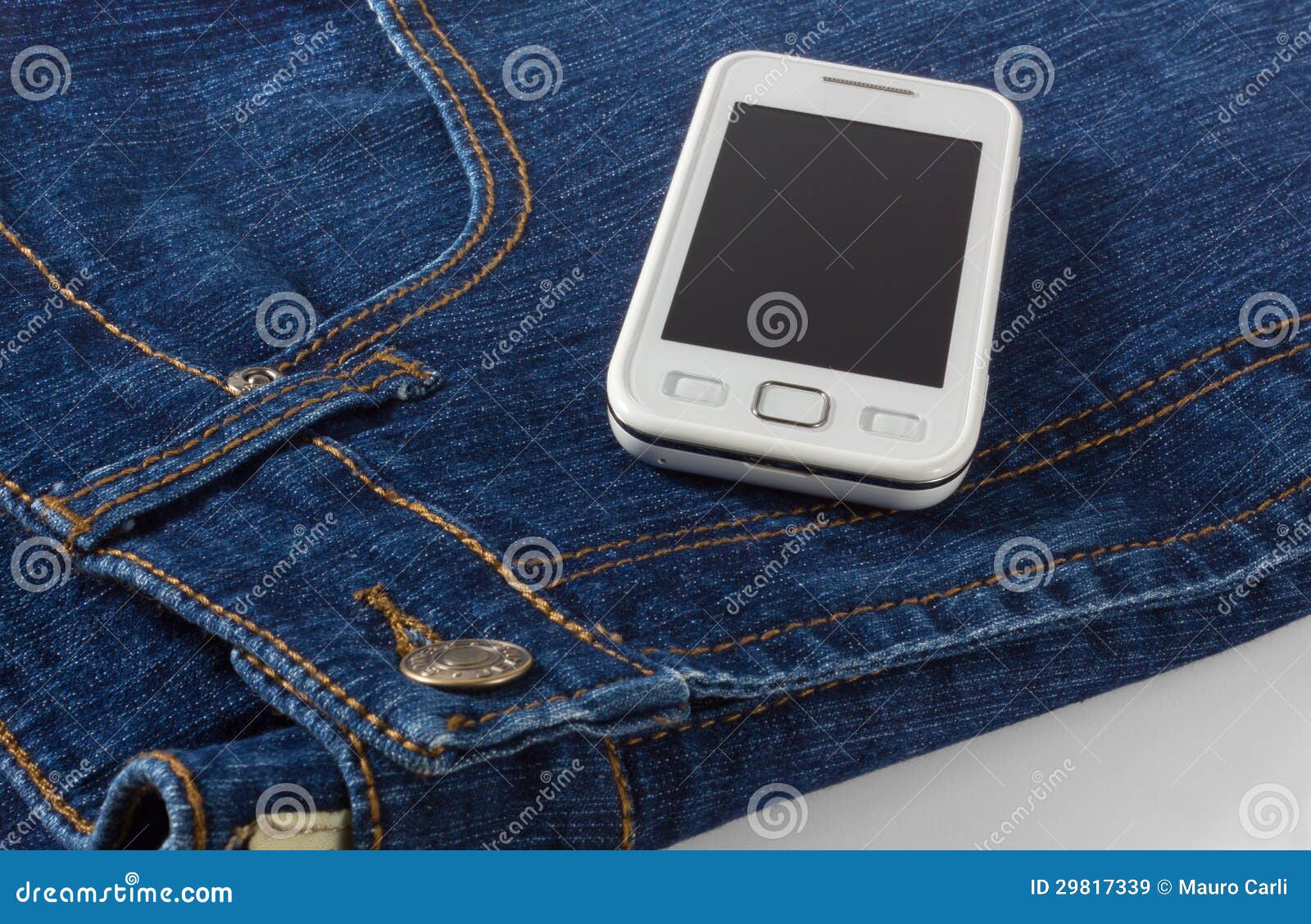 Mobile Phone on Blue Jeans stock image. Image of call 29817339