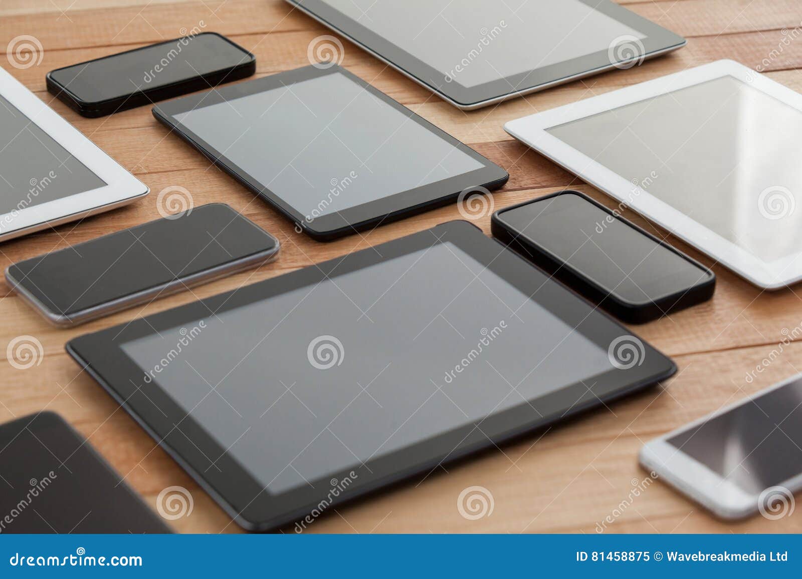 mobile phones and digital tablets on table