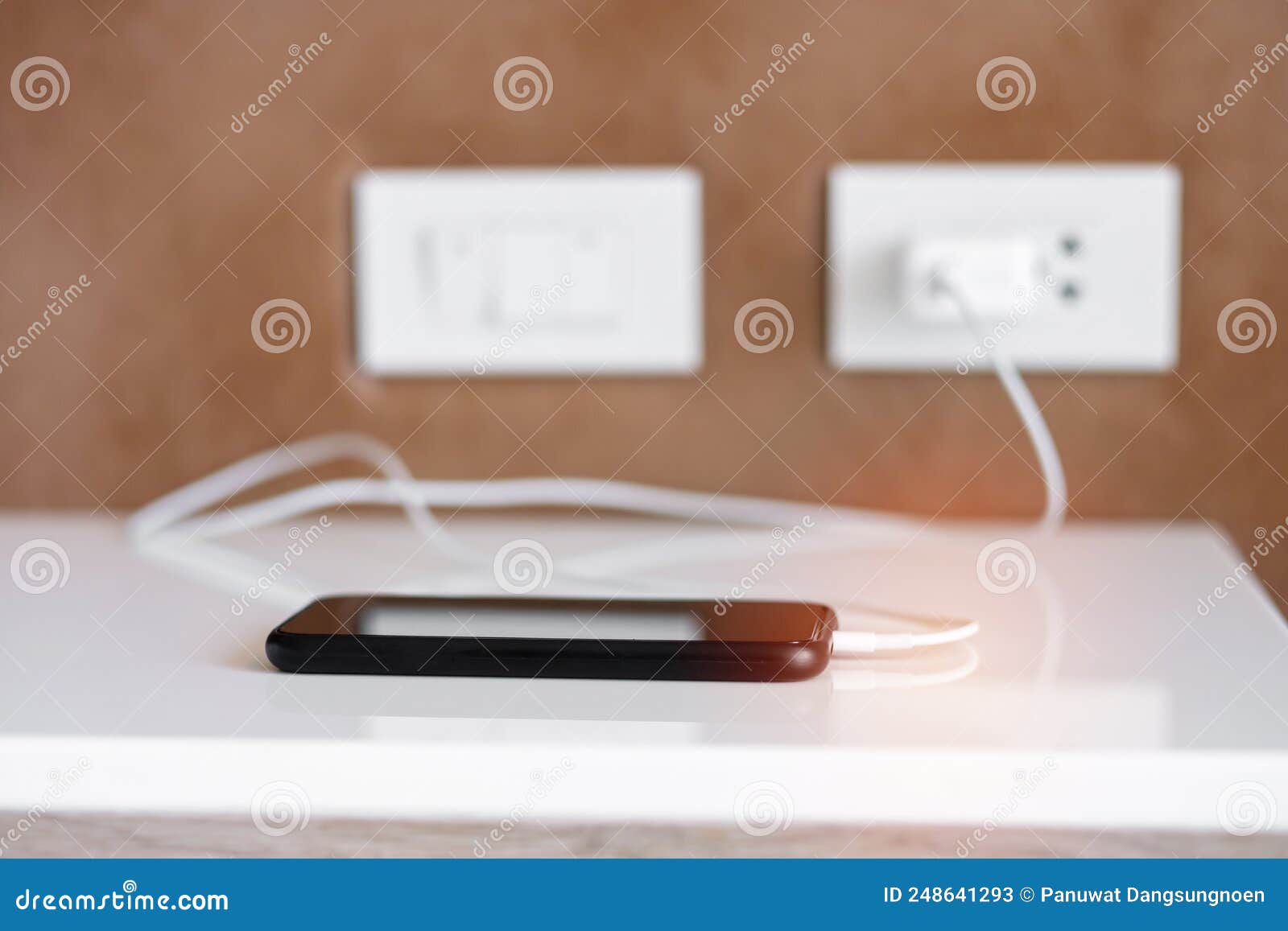 Mobile Smartphone Charging Battery on Table at Home or Office