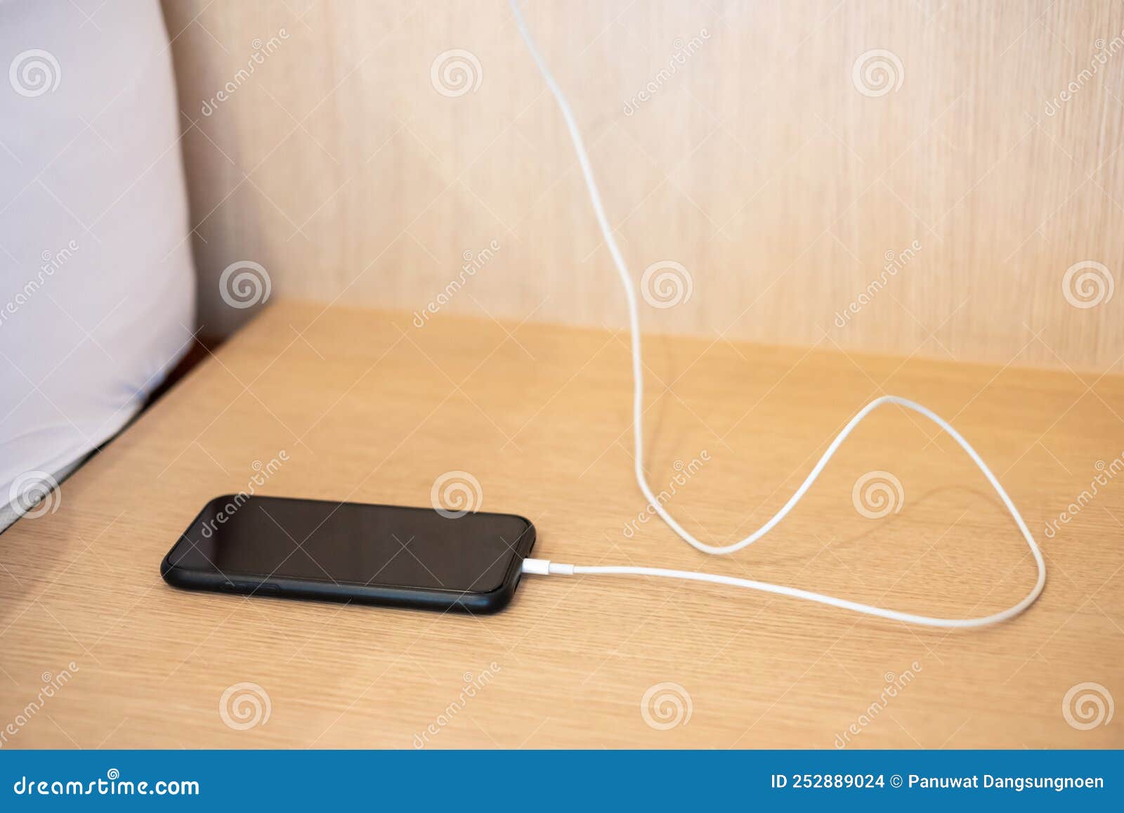 Mobile Smartphone Charging Battery on Table at Home or Office